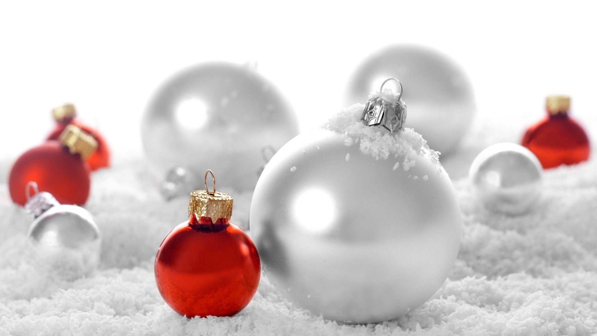 Silver and red Christmas ornaments in snow HD Wallpaper