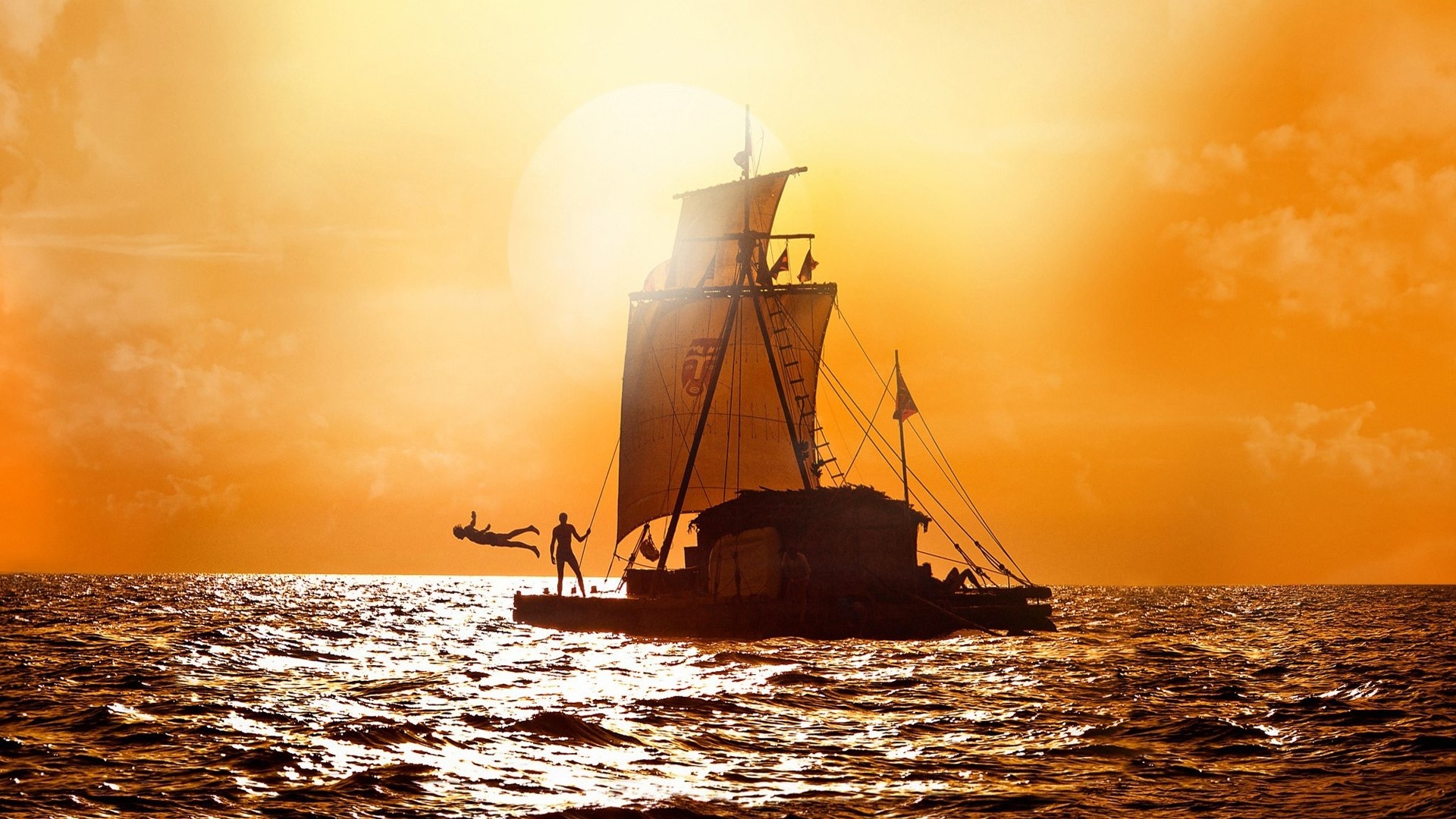 People on a raft sailing at sunset HD Wallpaper