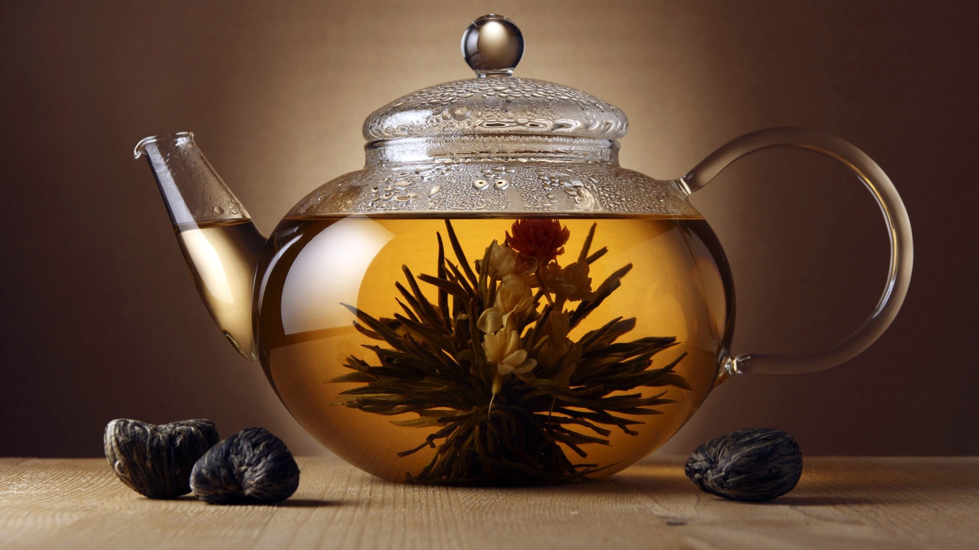 Blooming tea in a glass teapot HD Wallpaper