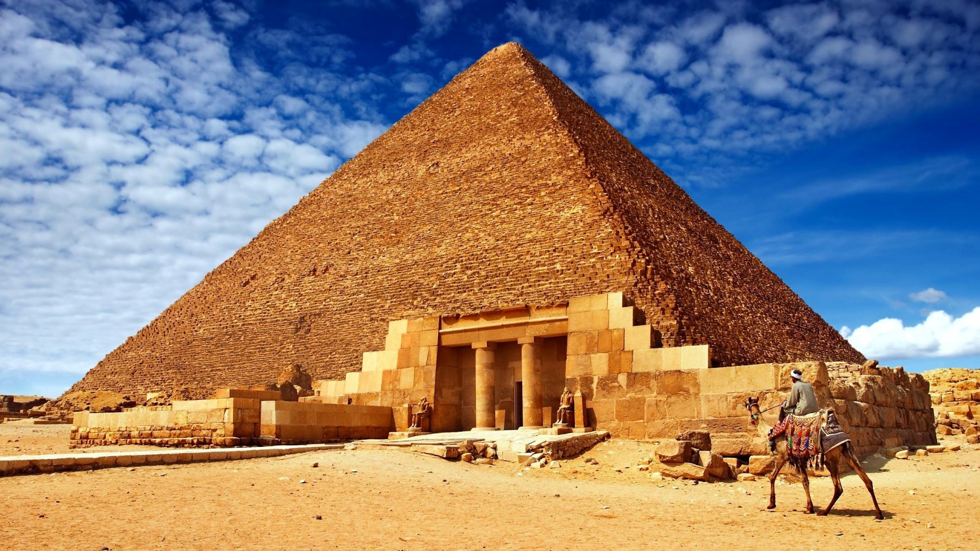 The Great Pyramid of Giza with a man on a camel HD Wallpaper