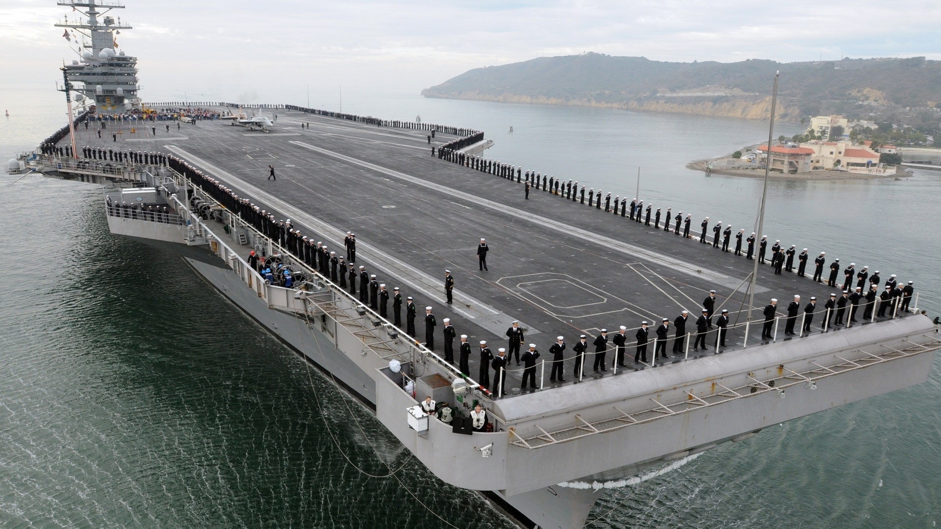 Sailors on the deck of an aircraft carrier HD Wallpaper