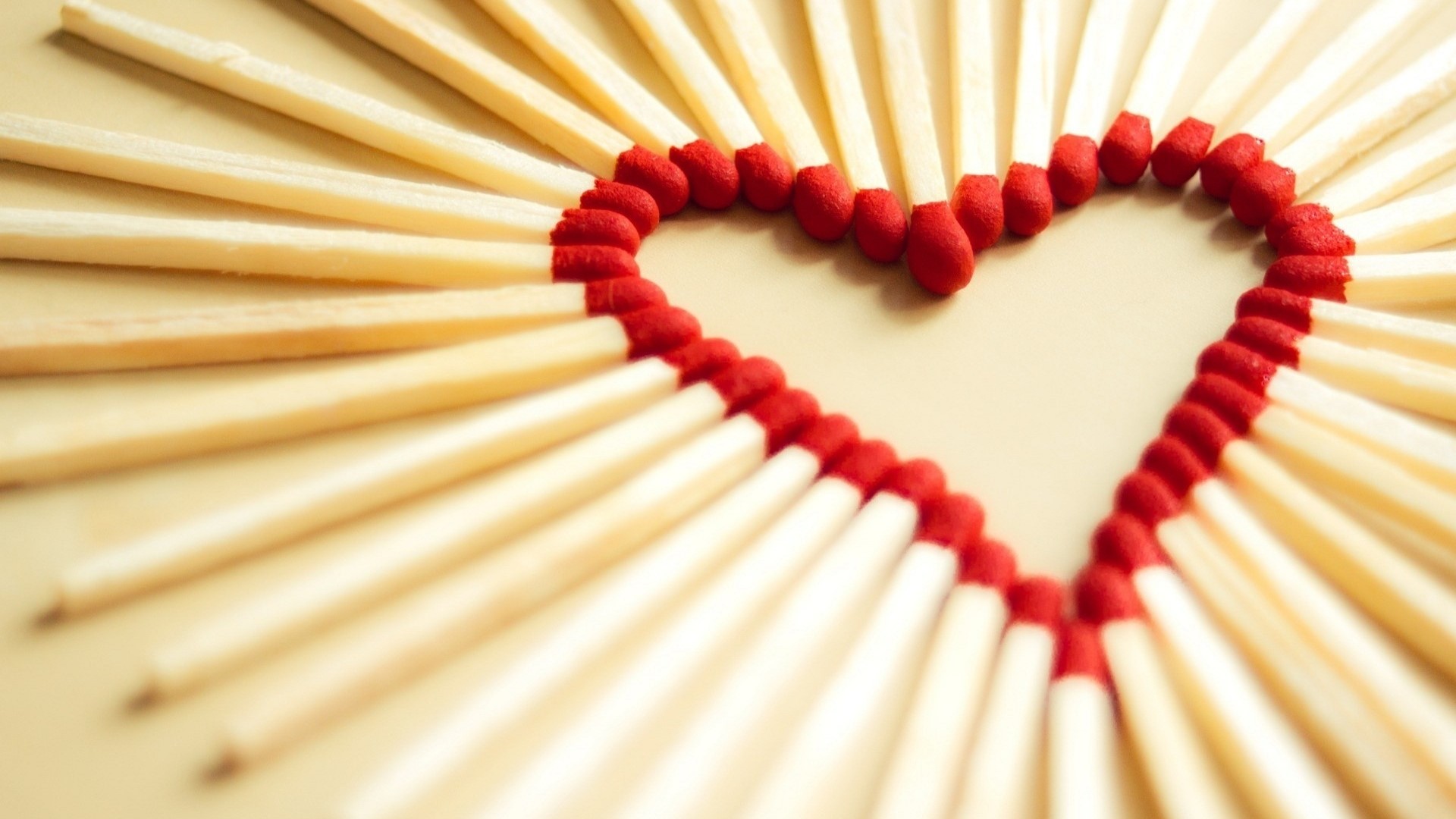Heart shape made of matches HD Wallpaper