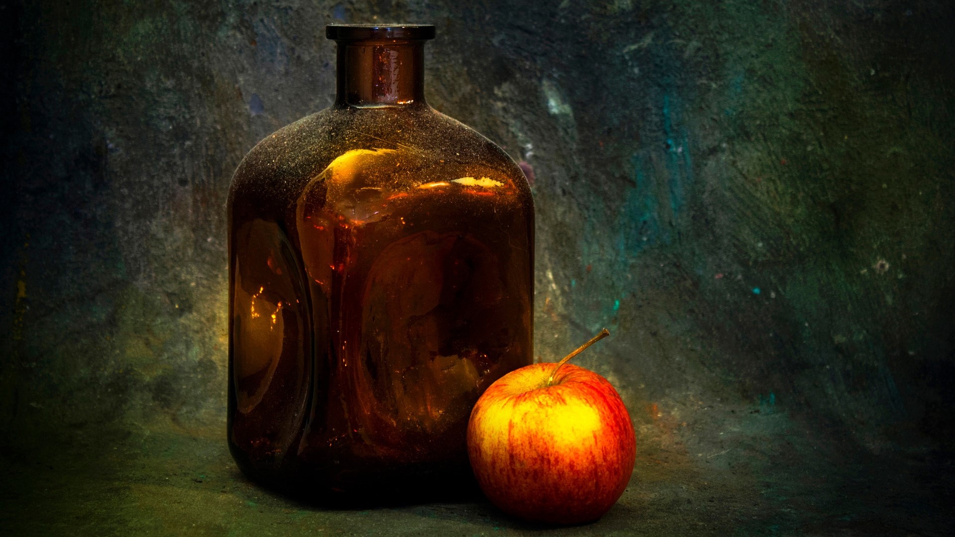 Old amber bottle and apple on textured background HD Wallpaper