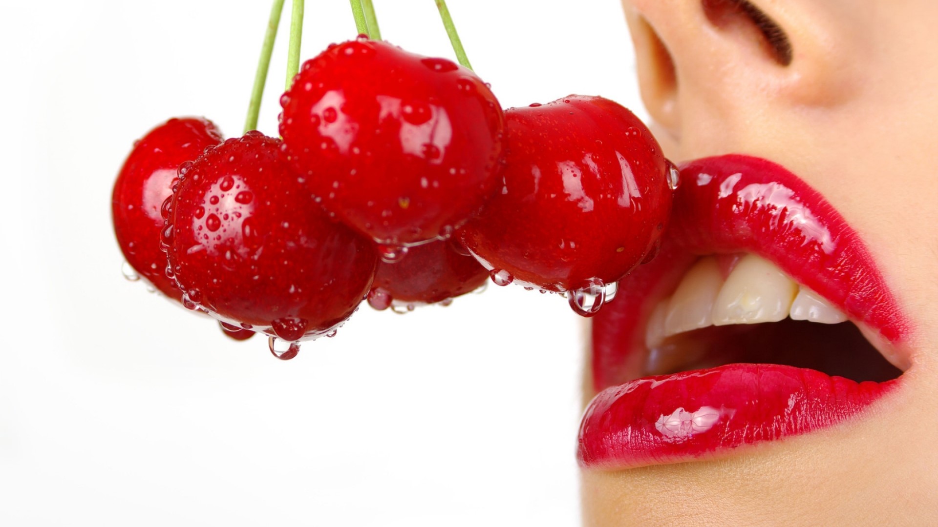 Close-up of red cherries and red lips HD Wallpaper