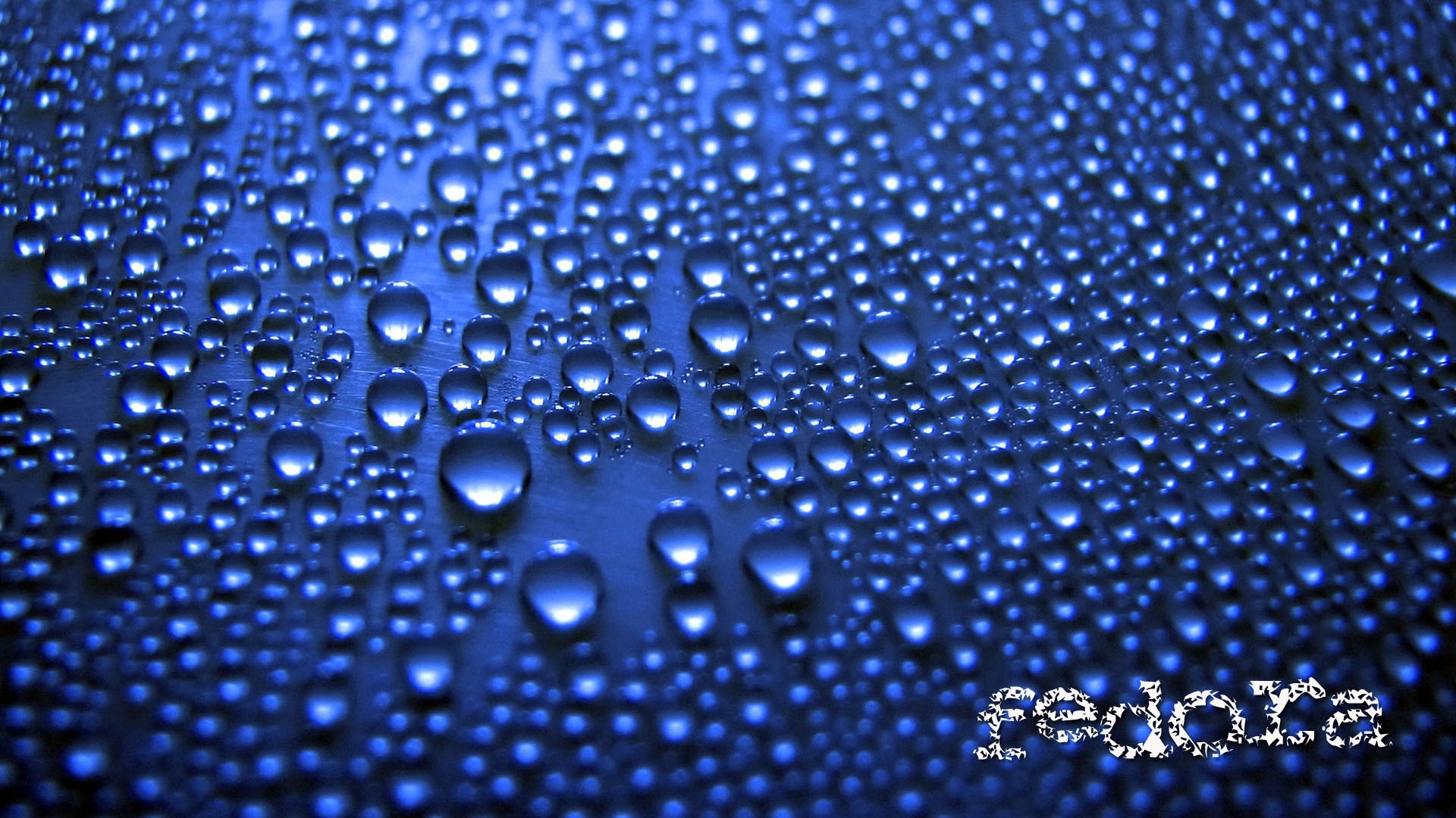 Fedora logo on water droplets HD Wallpaper