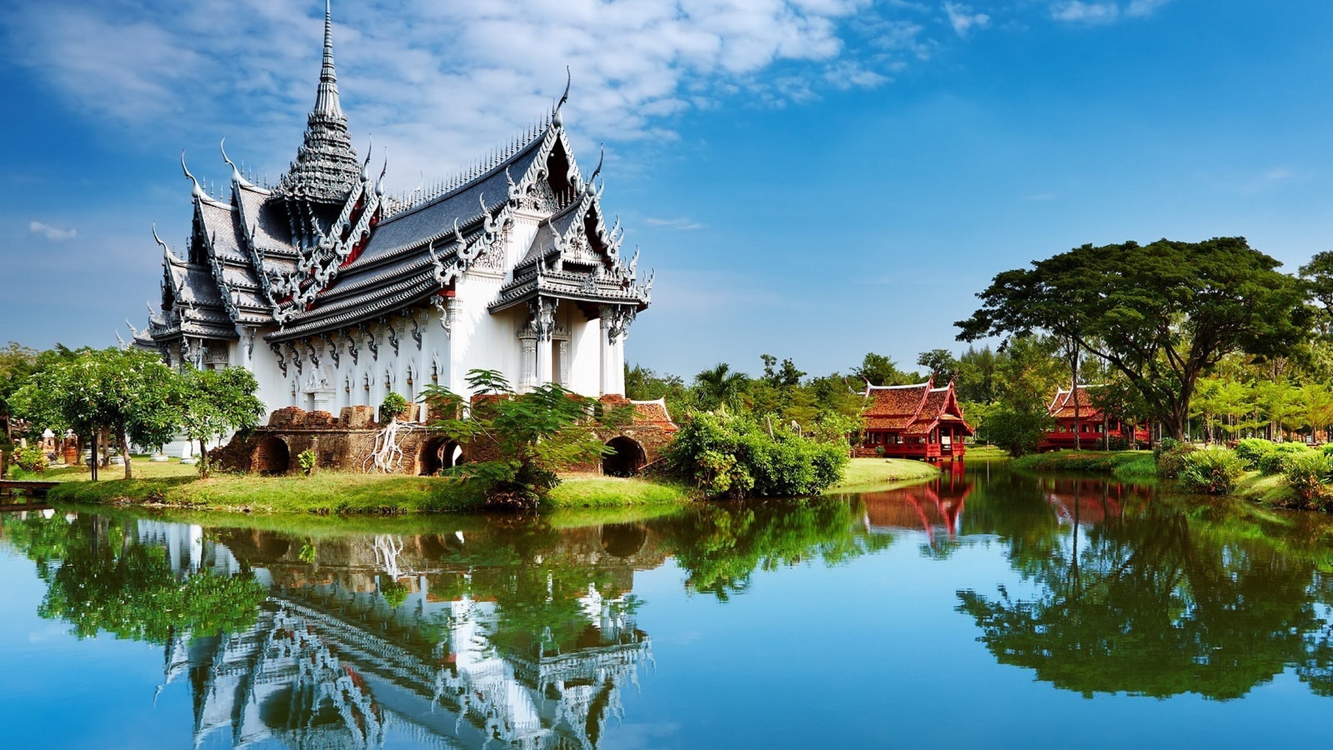 White Temple and Red Houses by Water in Thailand HD Wallpaper