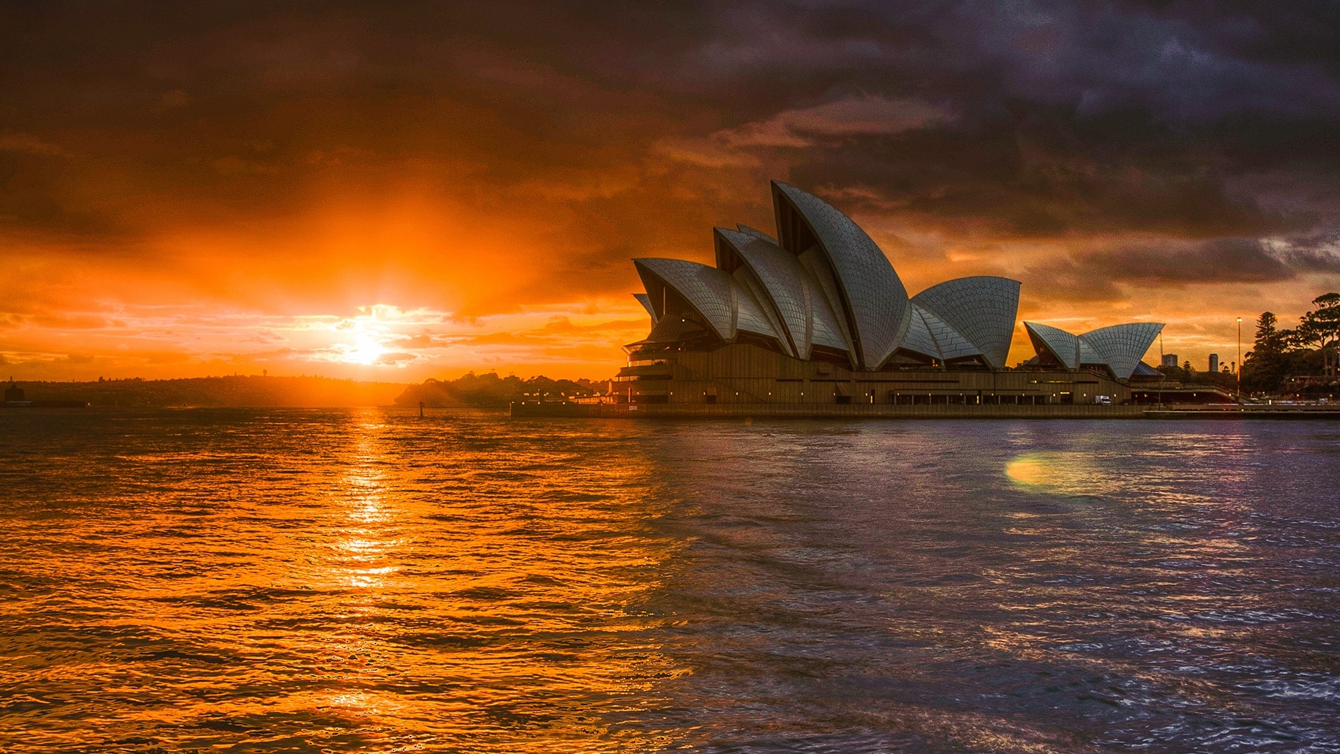 Sydney Opera House at sunset over water HD Wallpaper