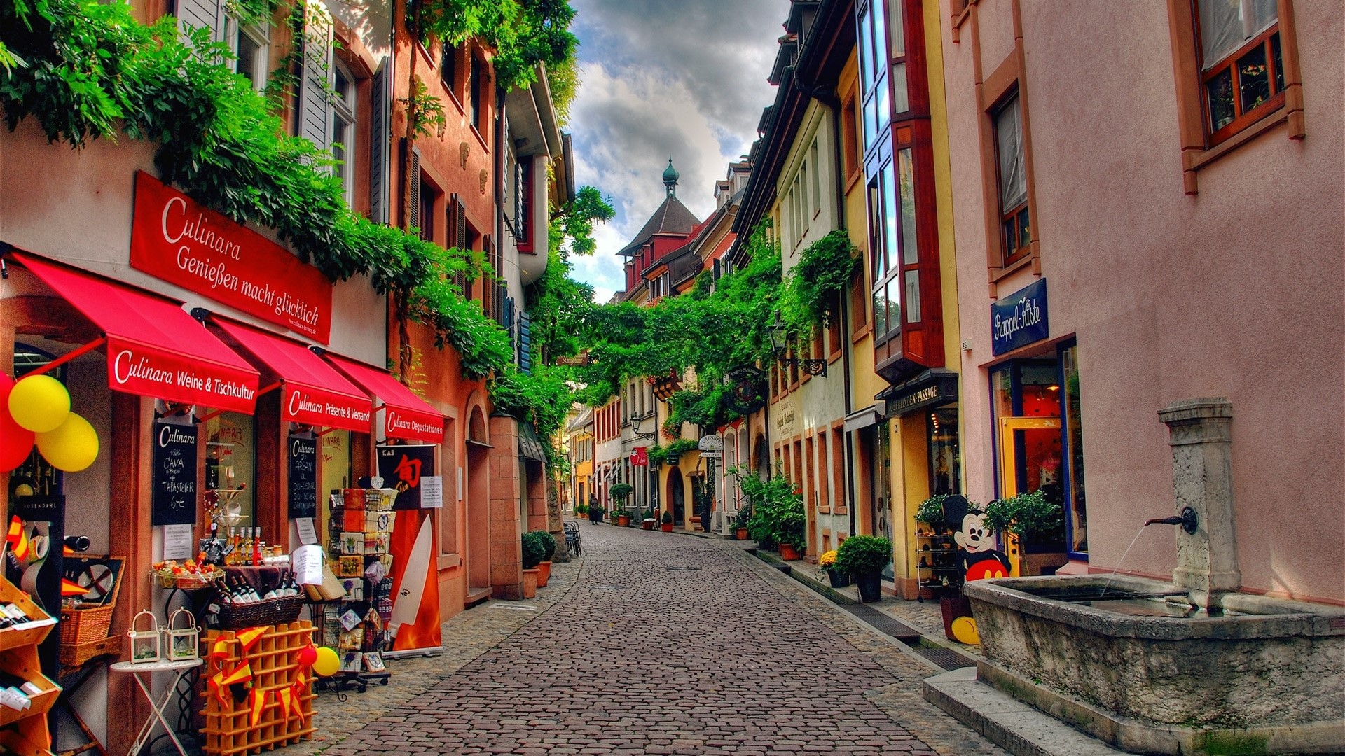 German street with shops and fountain HD Wallpaper