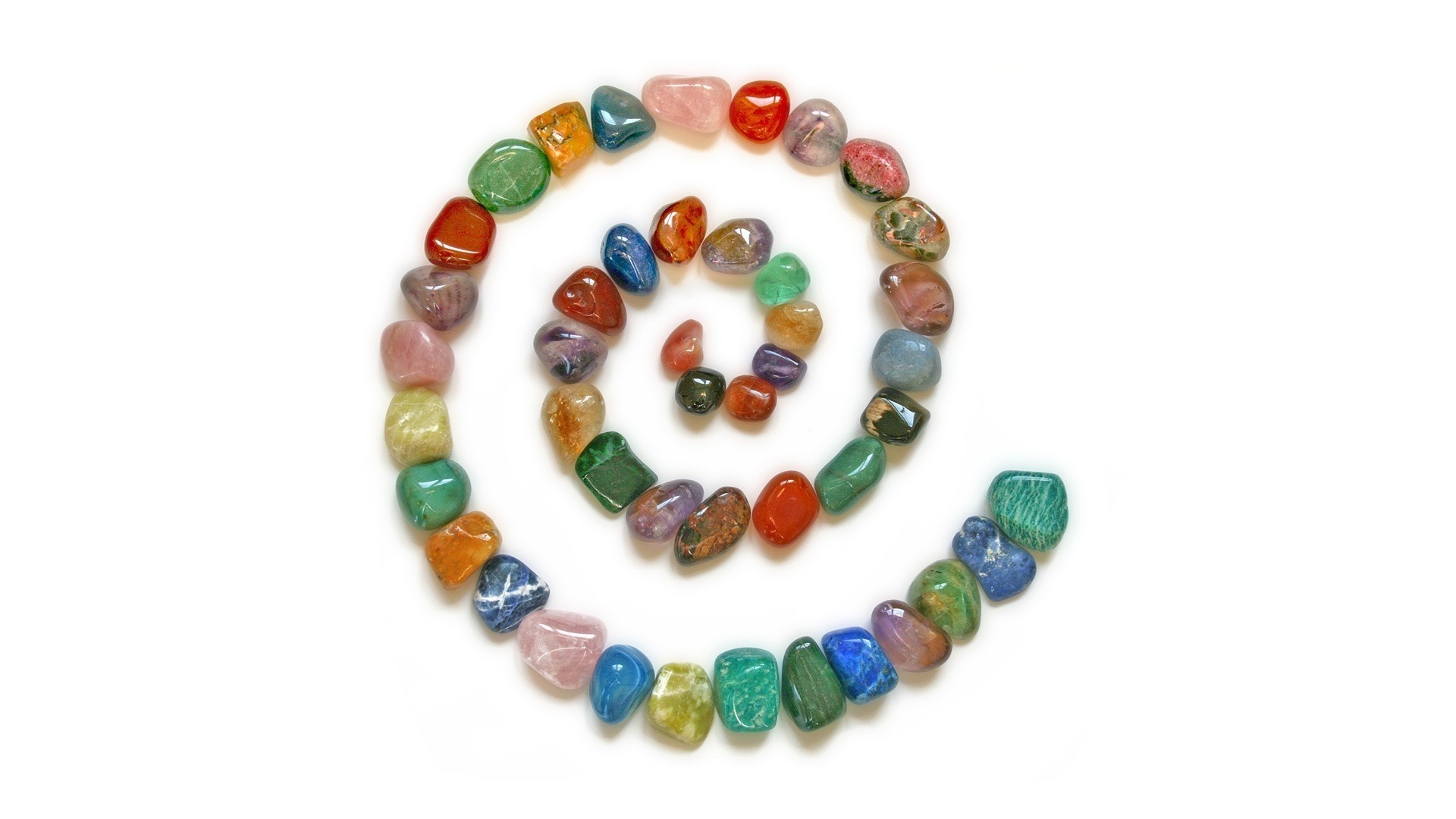 Polished stones arranged in a spiral HD Wallpaper