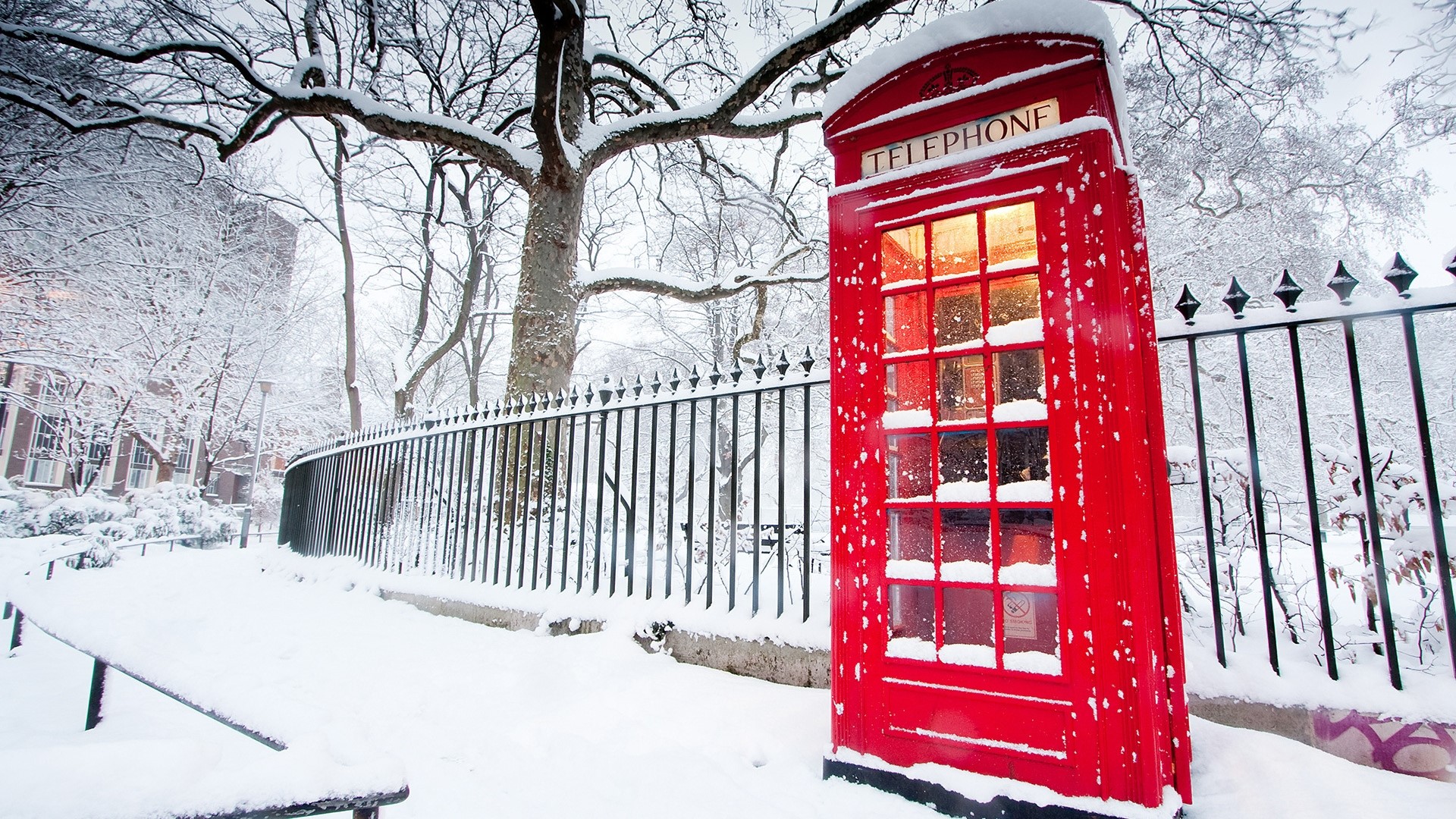 Red English phone booth in the snow HD Wallpaper