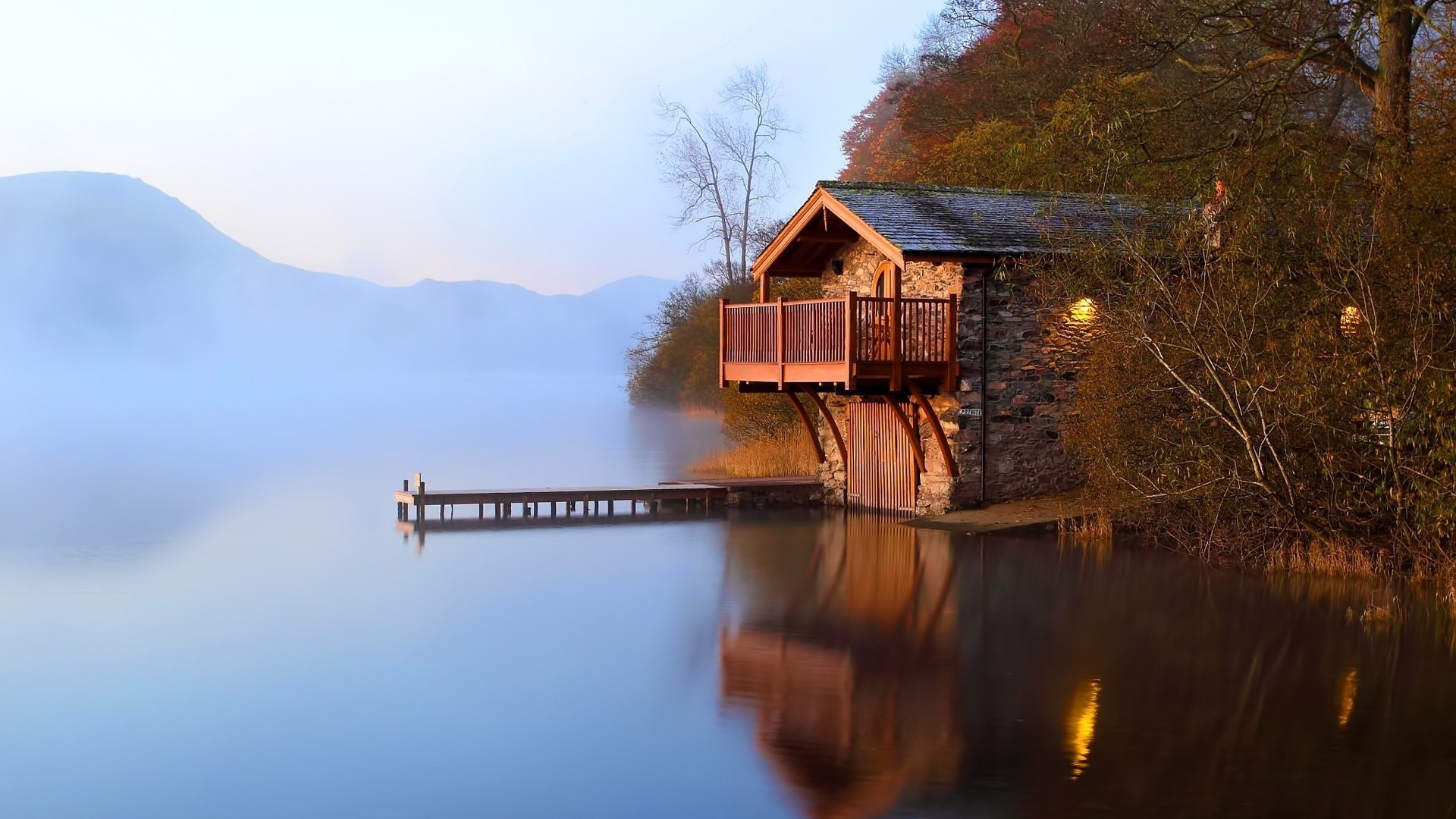 Stone boat house on a misty lake at dawn HD Wallpaper