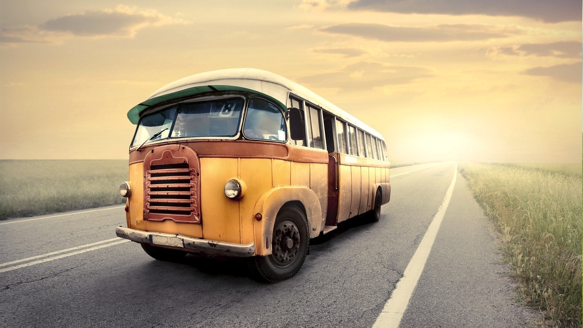 Vintage yellow bus on a road at sunset HD Wallpaper