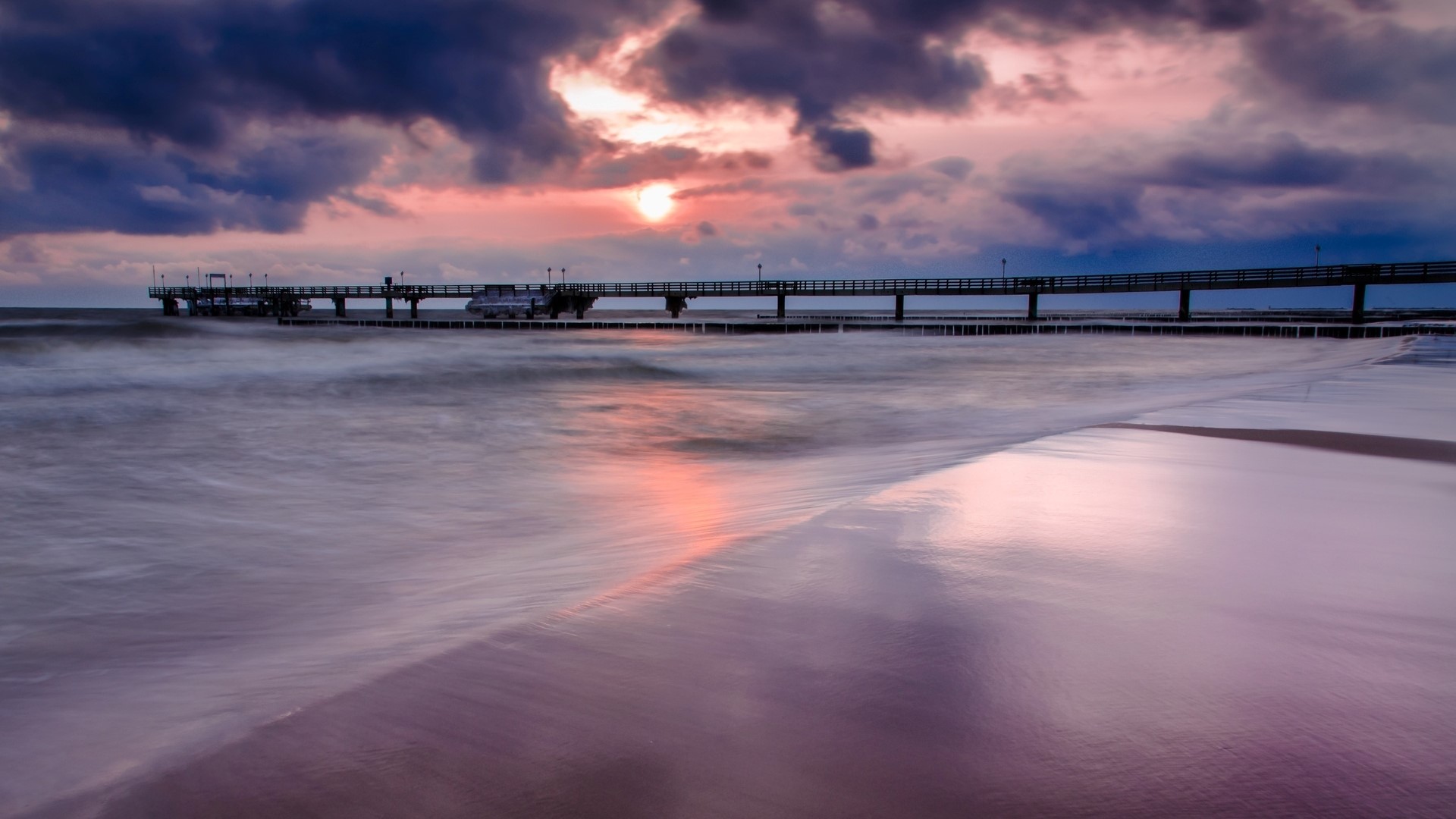 Sea bridge at sunset with pink clouds HD Wallpaper