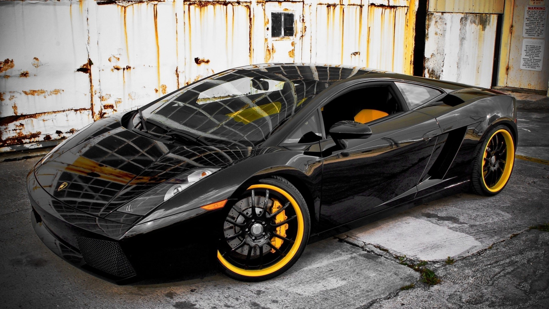 Black Lamborghini Gallardo with yellow accents HD Wallpaper