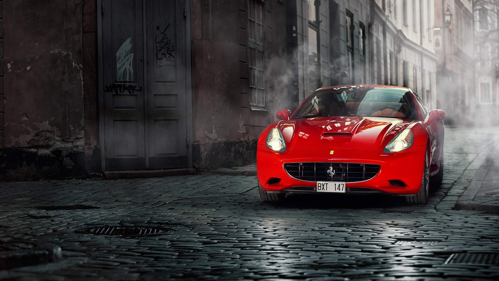 Red Ferrari California on Cobblestone Street HD Wallpaper