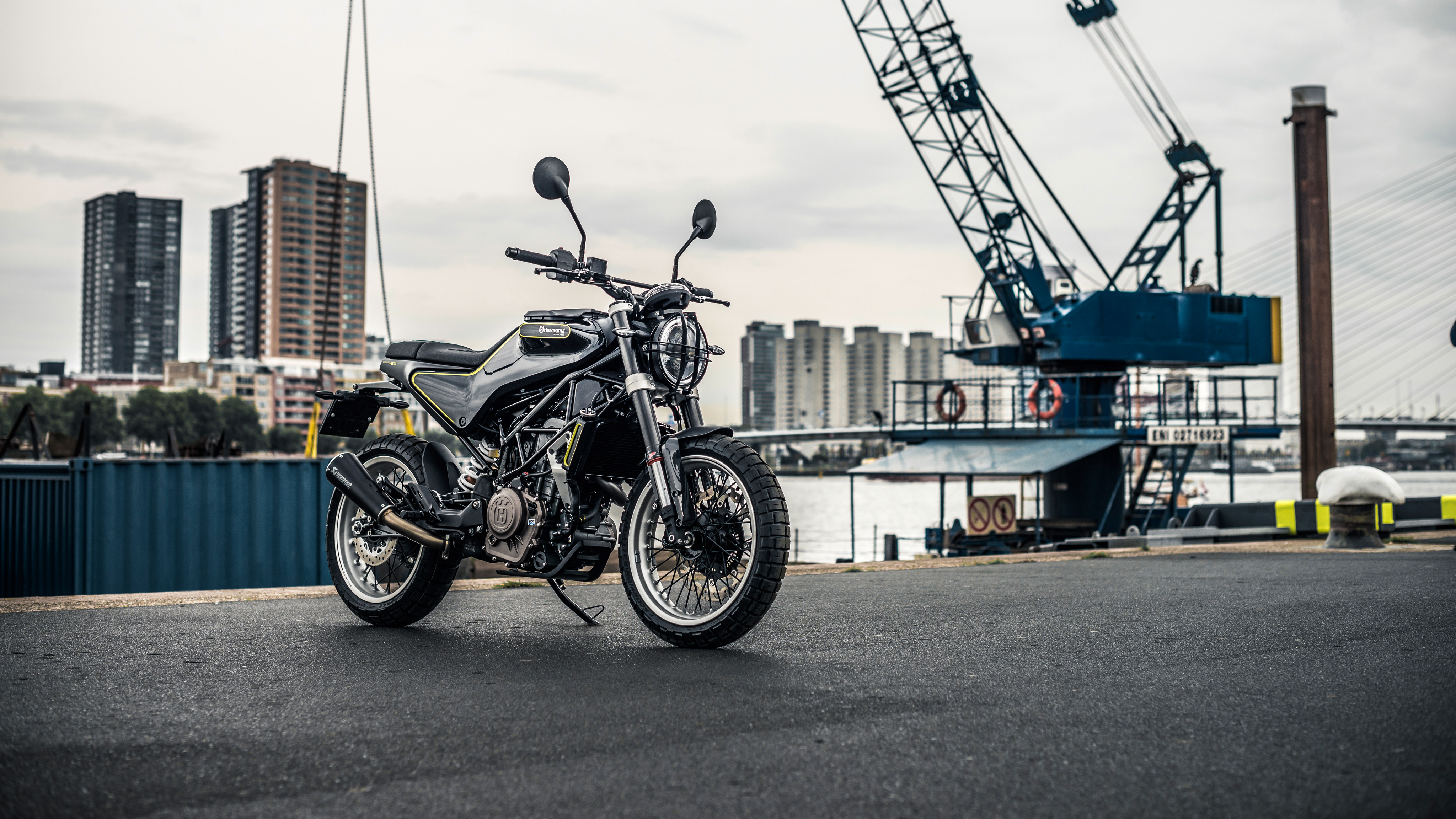 Husqvarna Svartpilen 401 motorcycle in industrial harbor HD Wallpaper