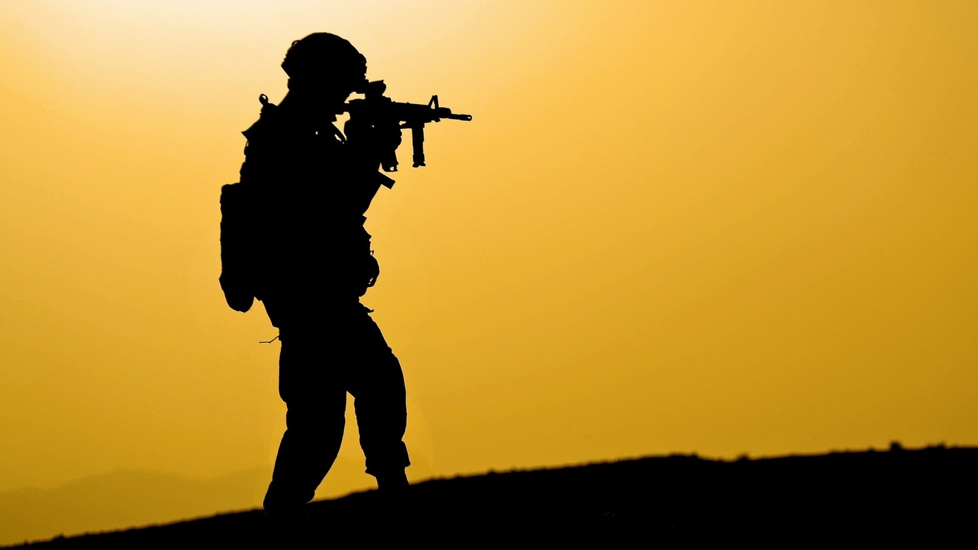 Soldier aiming a rifle at sunset HD Wallpaper