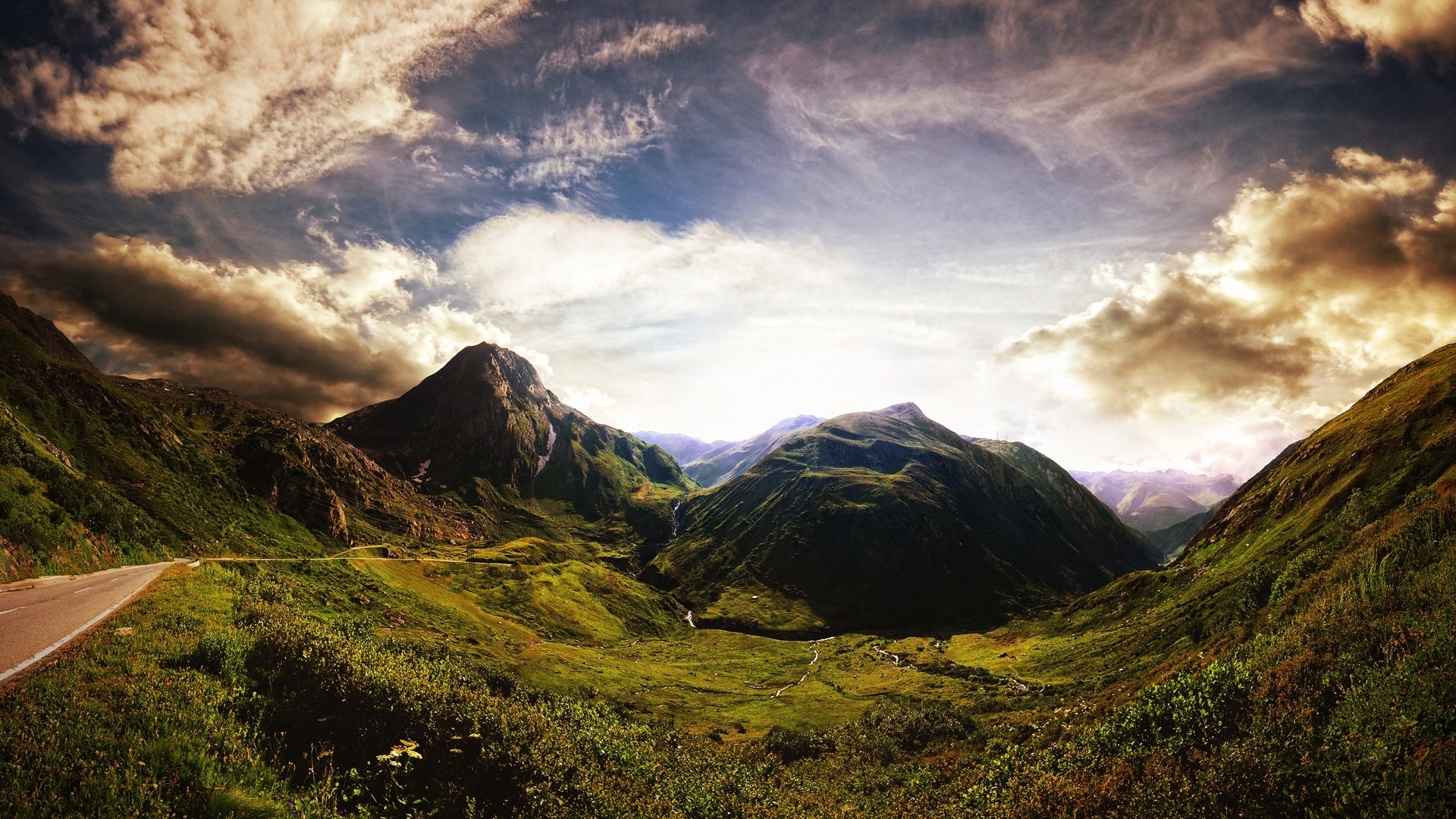 Panoramic view of mountains and a road HD Wallpaper