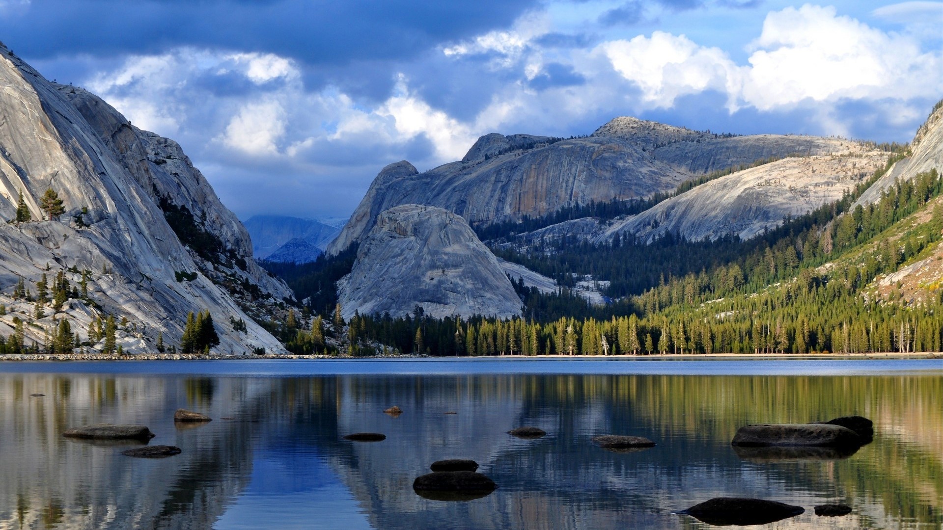 Mountain lake with reflections and dramatic clouds HD Wallpaper