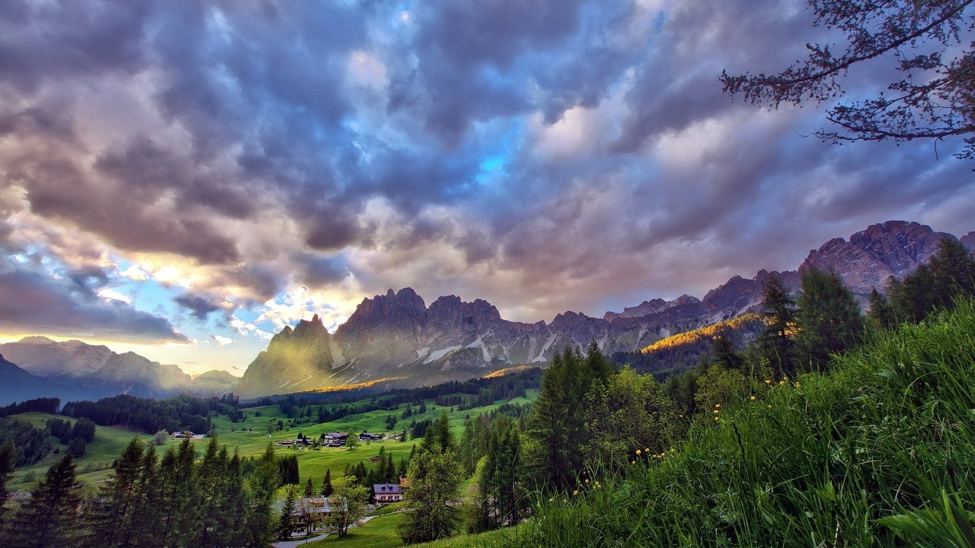 Mountain landscape with dramatic clouds and green valley HD Wallpaper