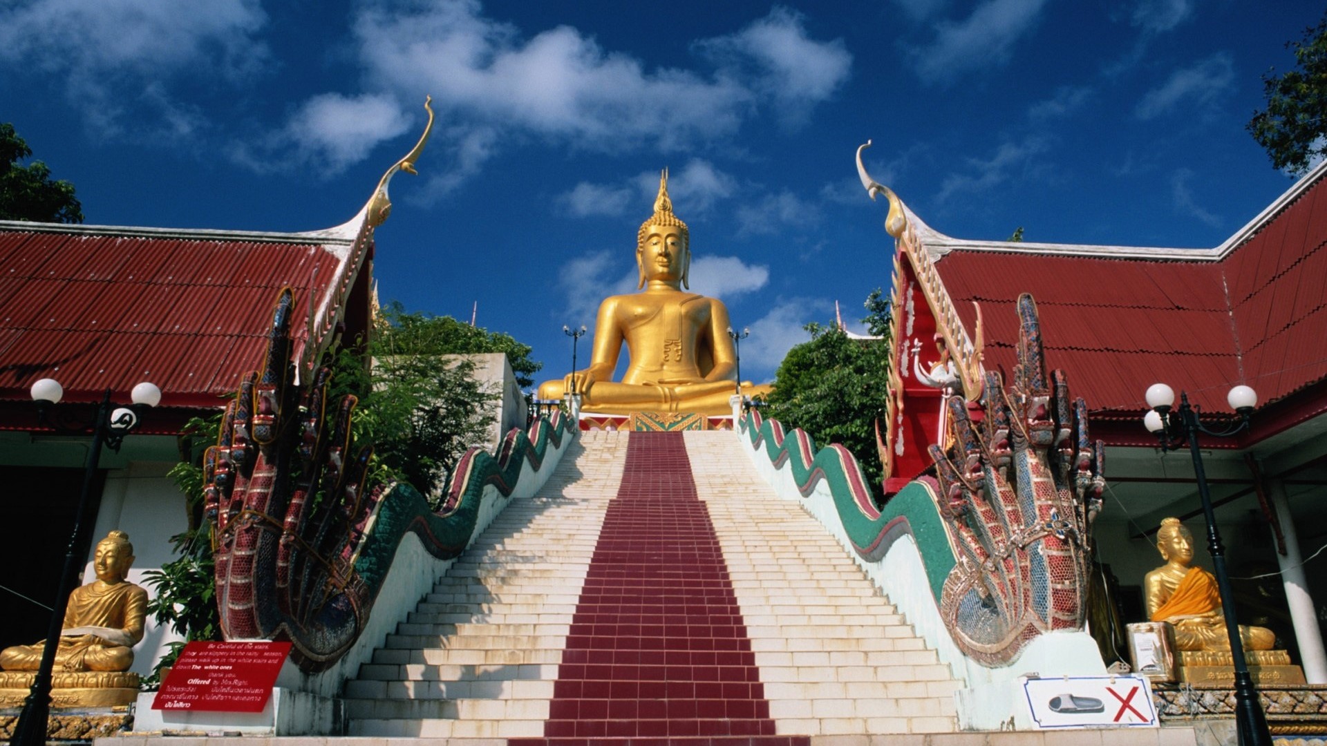 Golden Buddha statue at a temple in Thailand HD Wallpaper