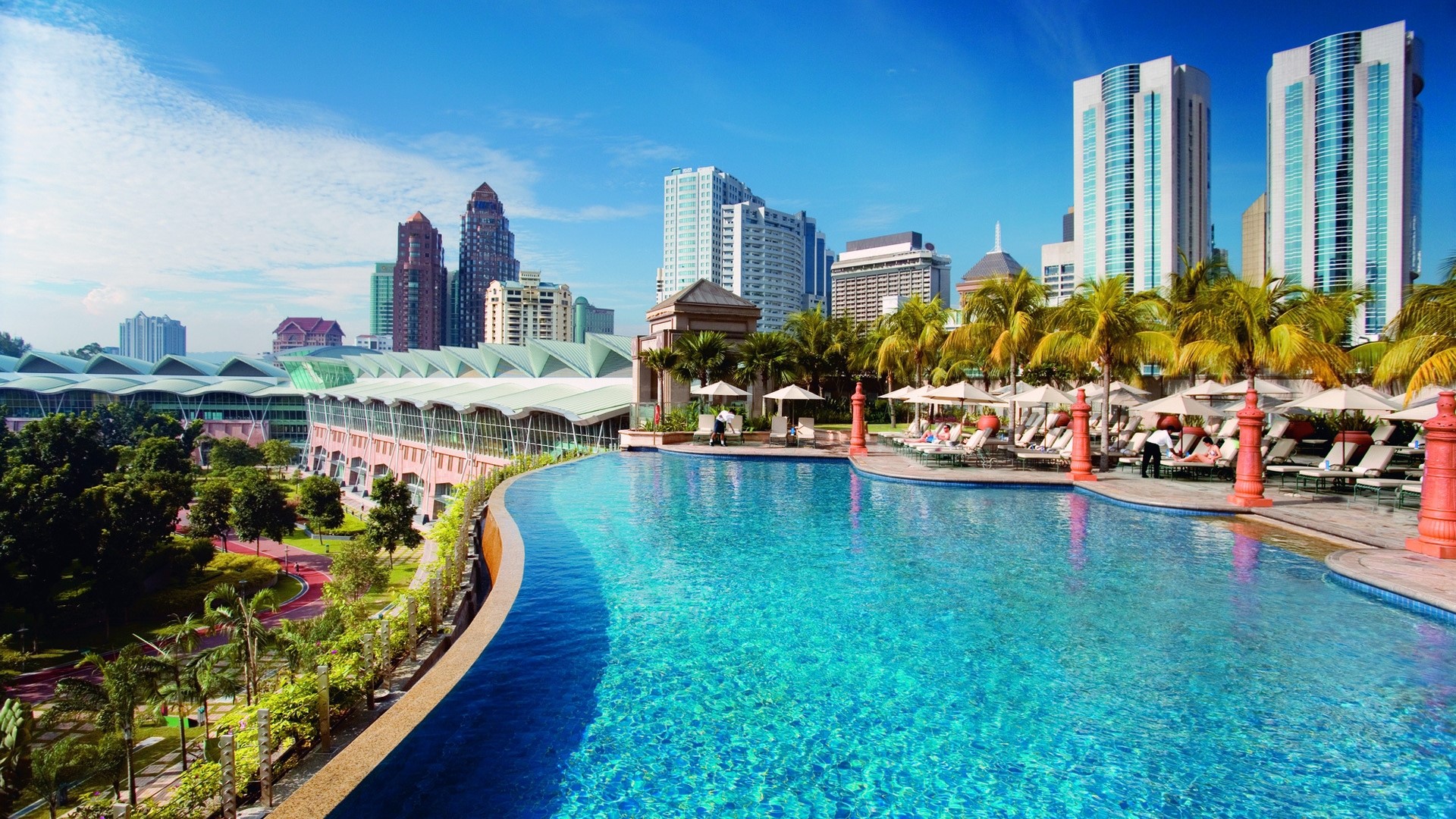 Infinity pool overlooking Kuala Lumpur skyline HD Wallpaper