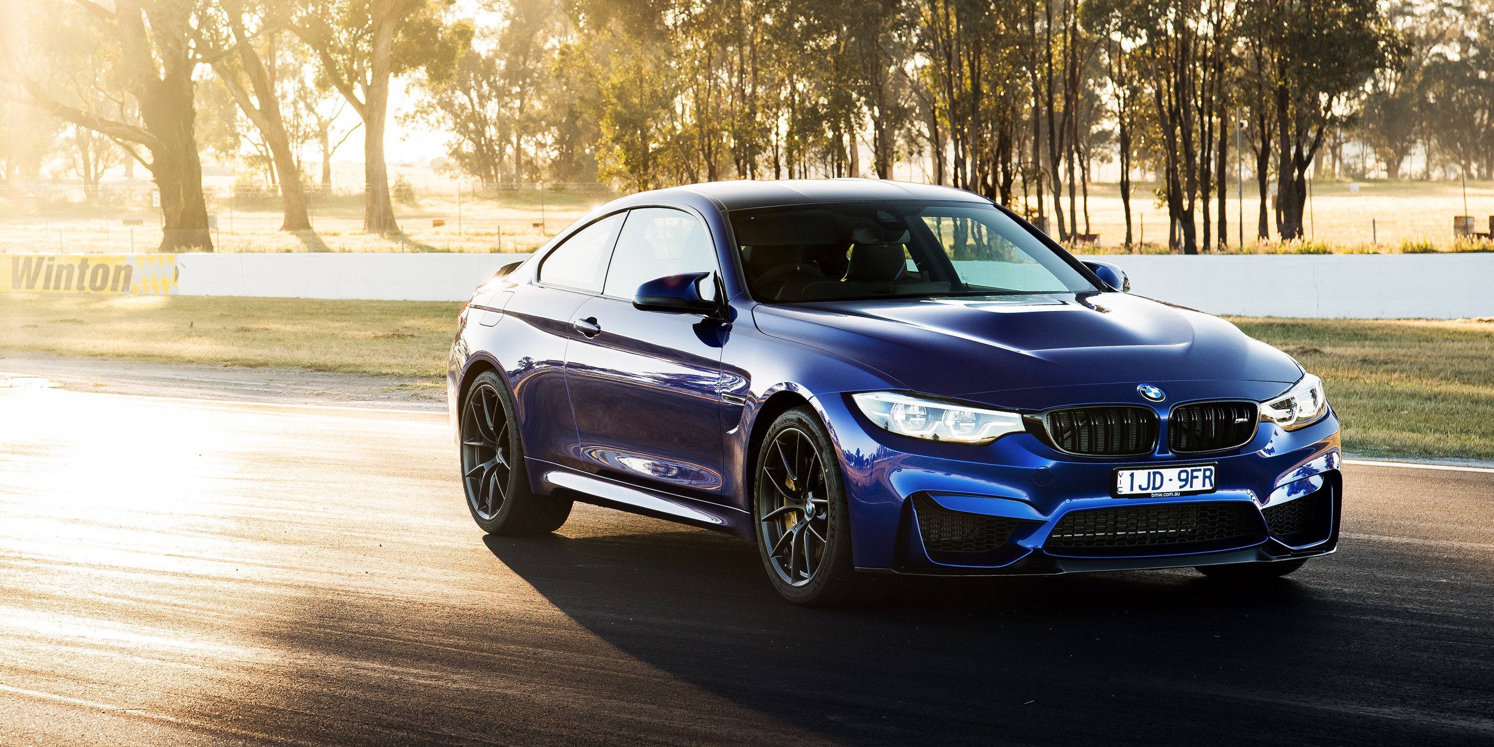 2018 BMW M4 CS on a racetrack HD Wallpaper