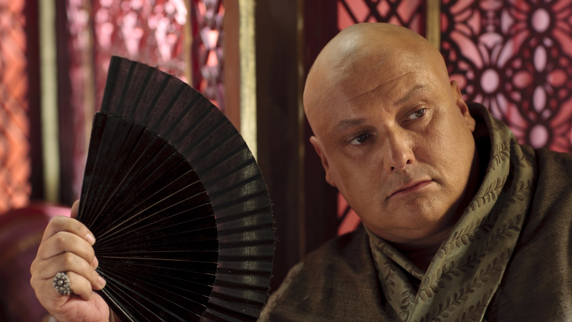Varys from Game of Thrones holding a fan HD Wallpaper