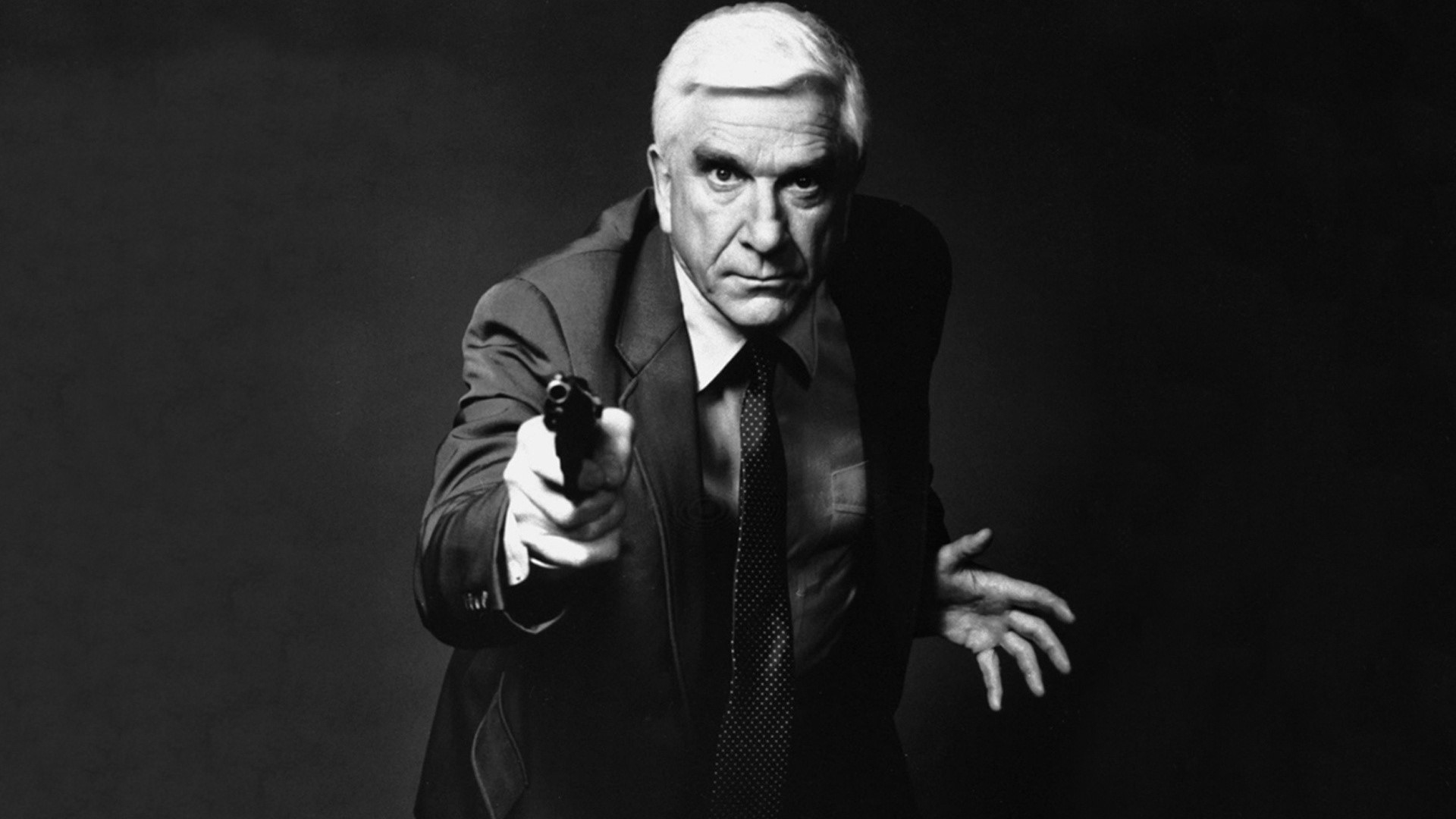 Leslie Nielsen holding a gun HD Wallpaper