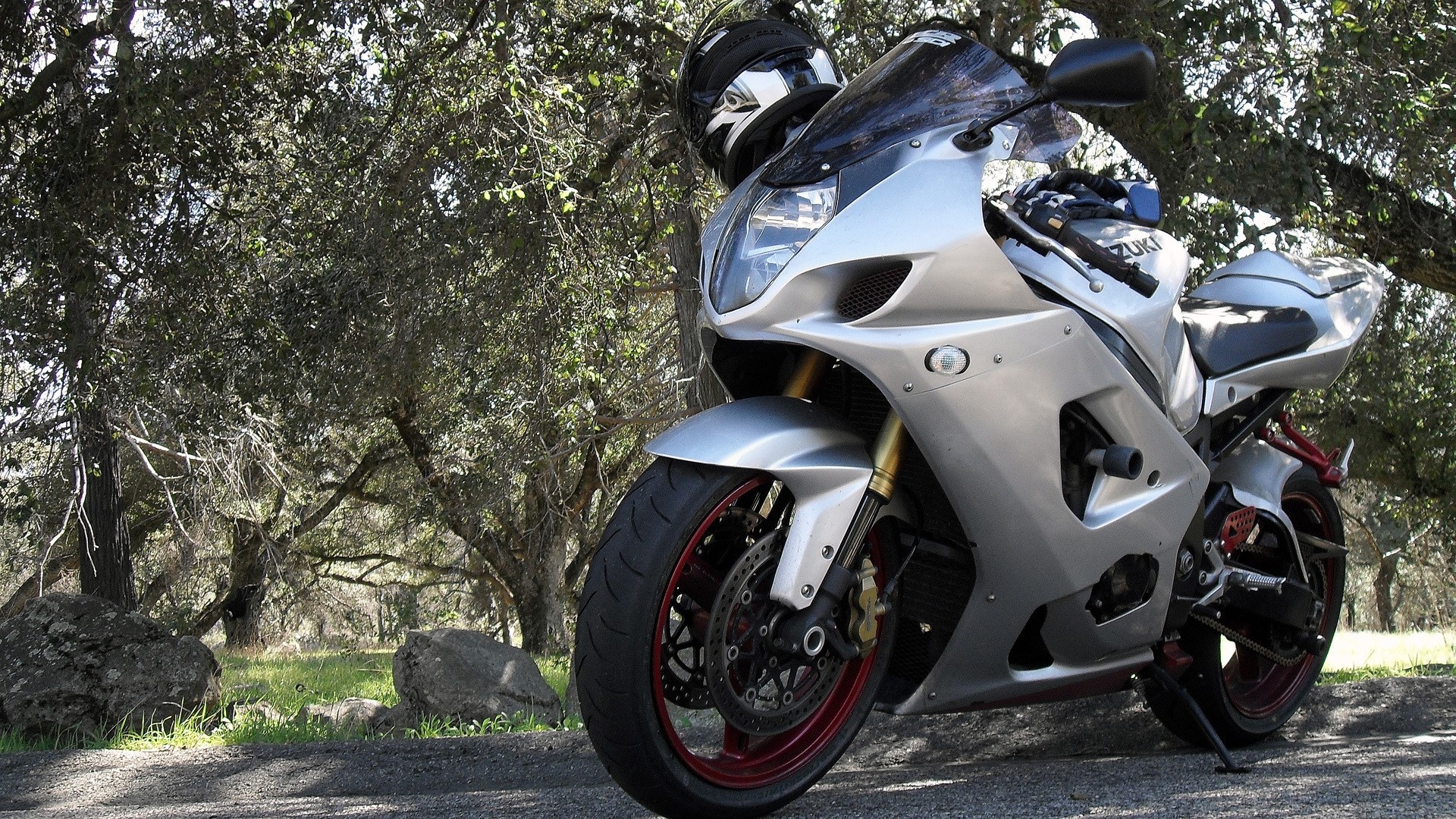 Silver Suzuki Superbike Motorcycle with Helmet HD Wallpaper