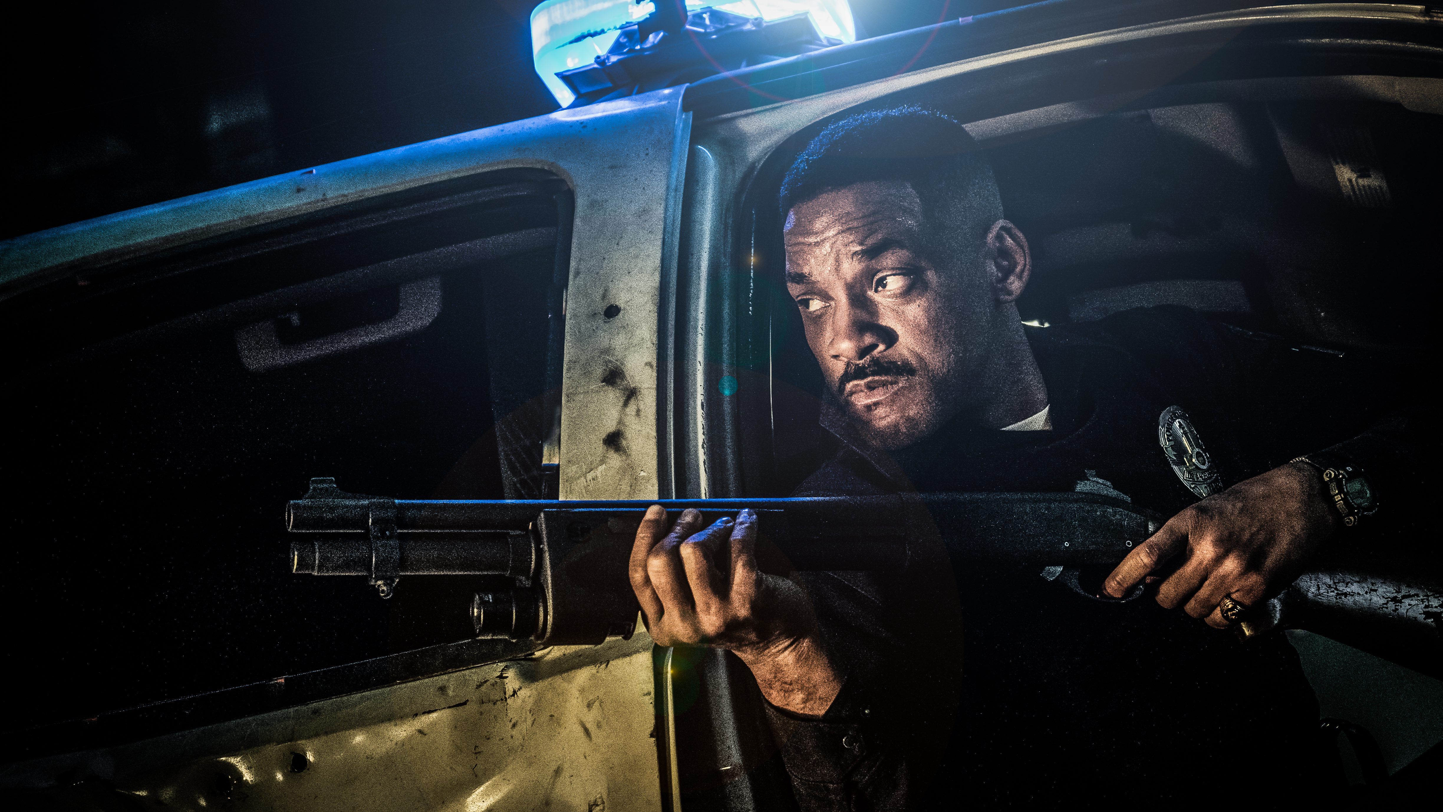 Will Smith in a police car holding a shotgun HD Wallpaper