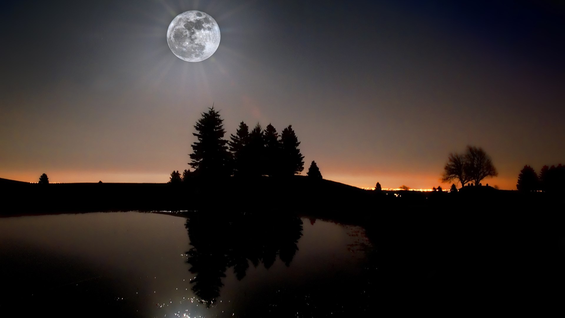 Full moon over a dark landscape with a lake HD Wallpaper