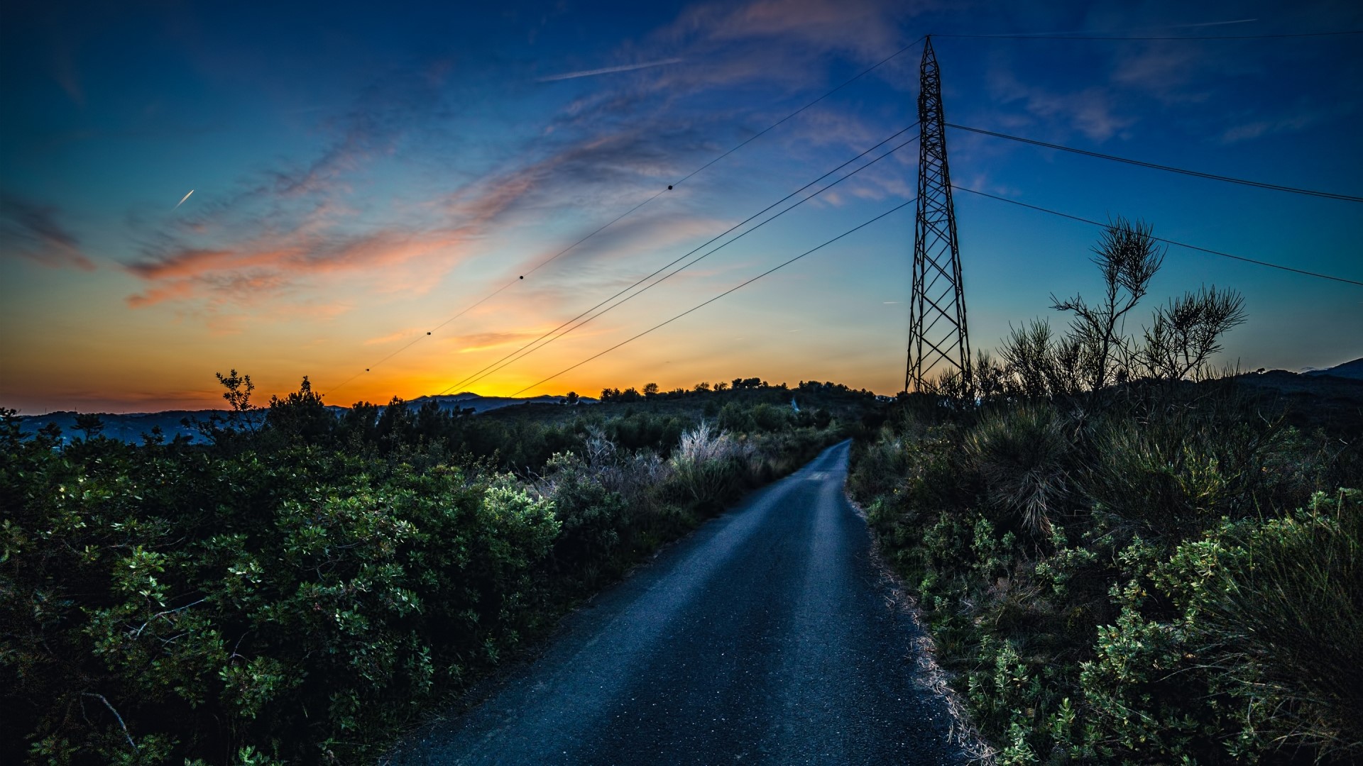 Country road at sunset with power lines HD Wallpaper