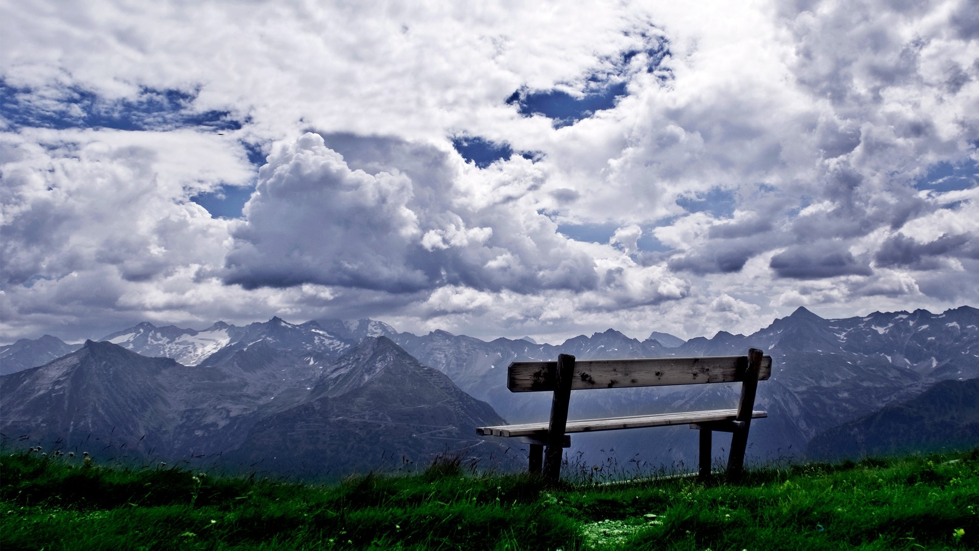 Wooden bench overlooking mountain range HD Wallpaper