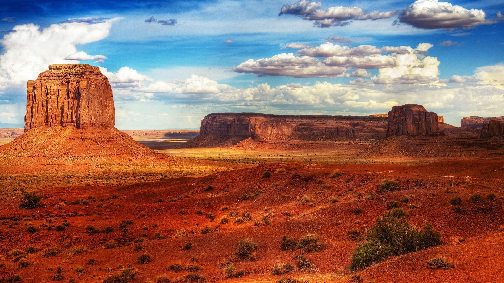 Monument Valley desert landscape with mesas and buttes HD Wallpaper