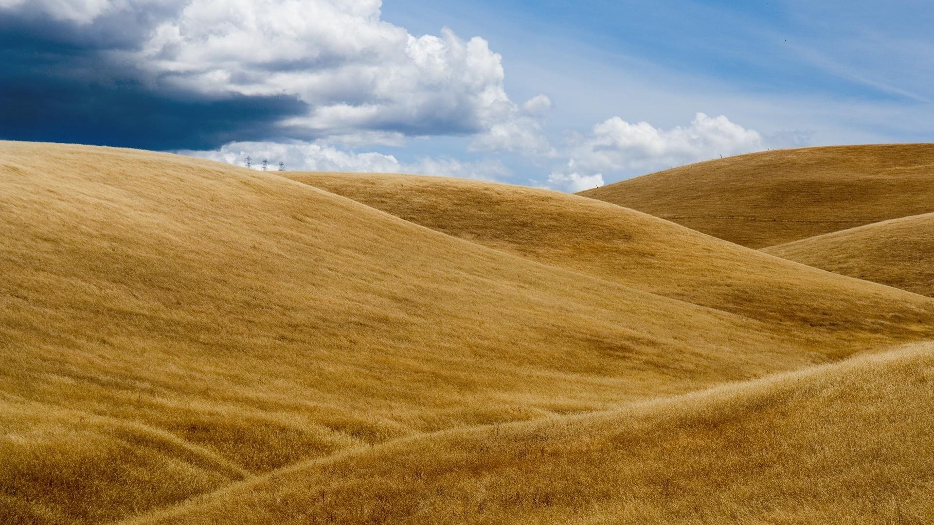 Golden Hills Under Cloudy Sky HD Wallpaper