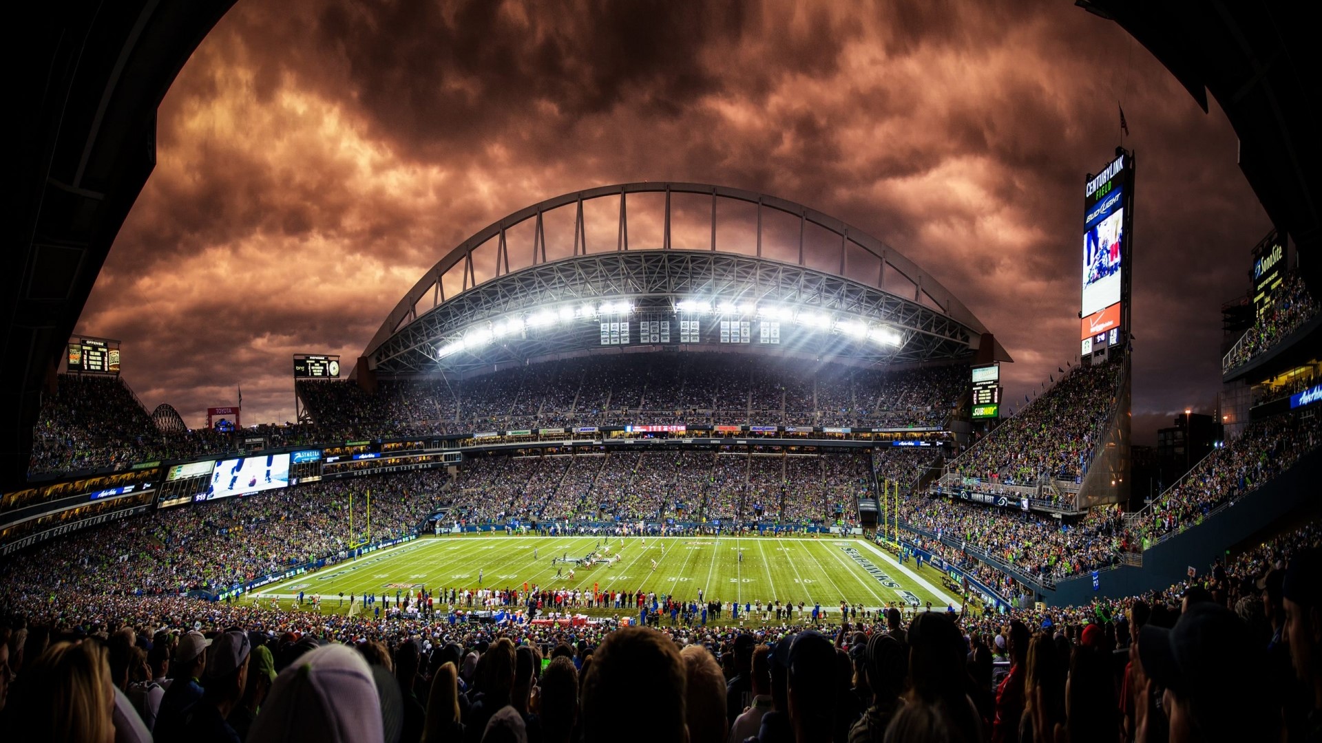 Seattle Football Stadium under stormy skies HD Wallpaper