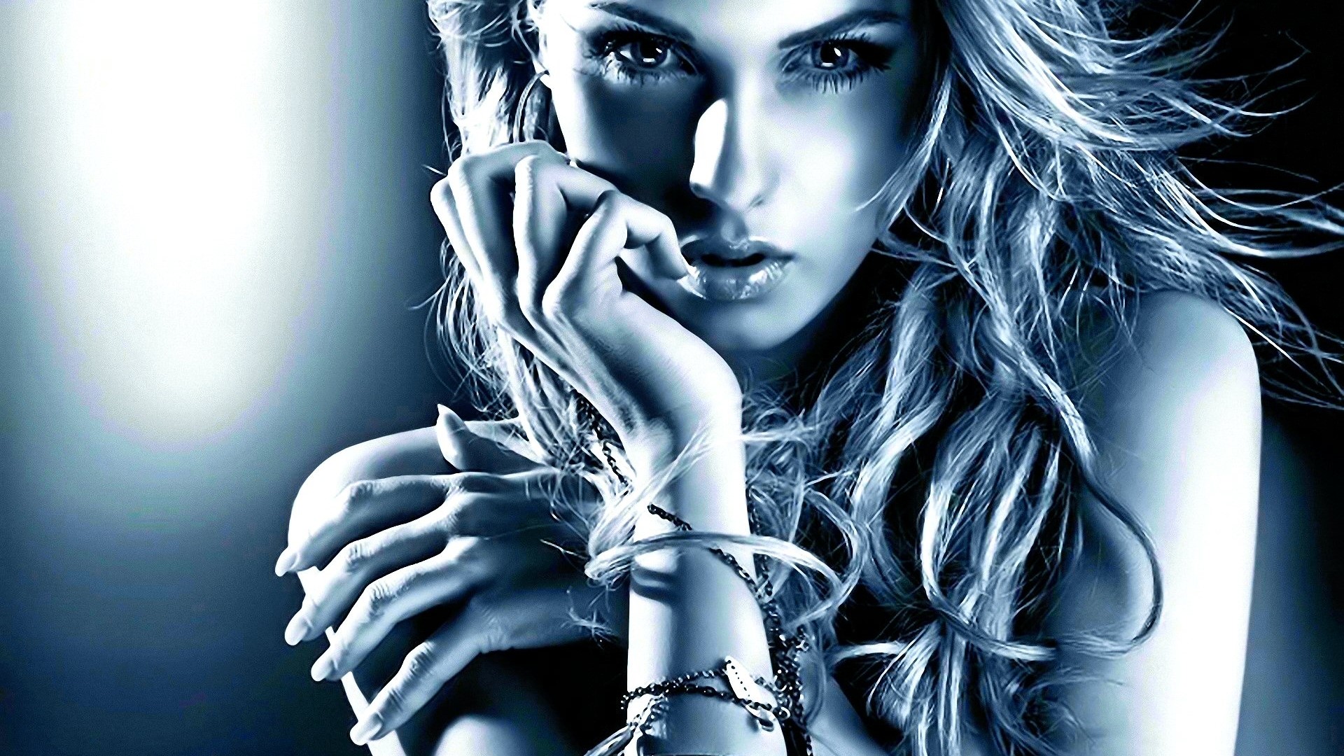 Woman with long wavy hair and jewelry HD Wallpaper