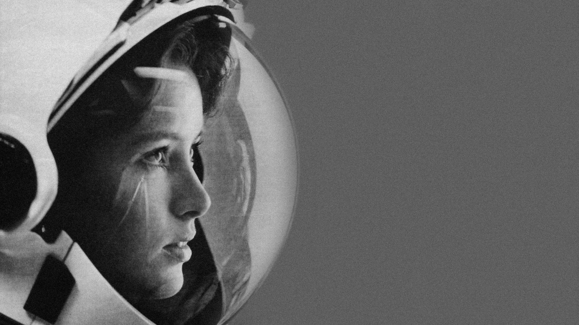 Young woman in astronaut helmet HD Wallpaper