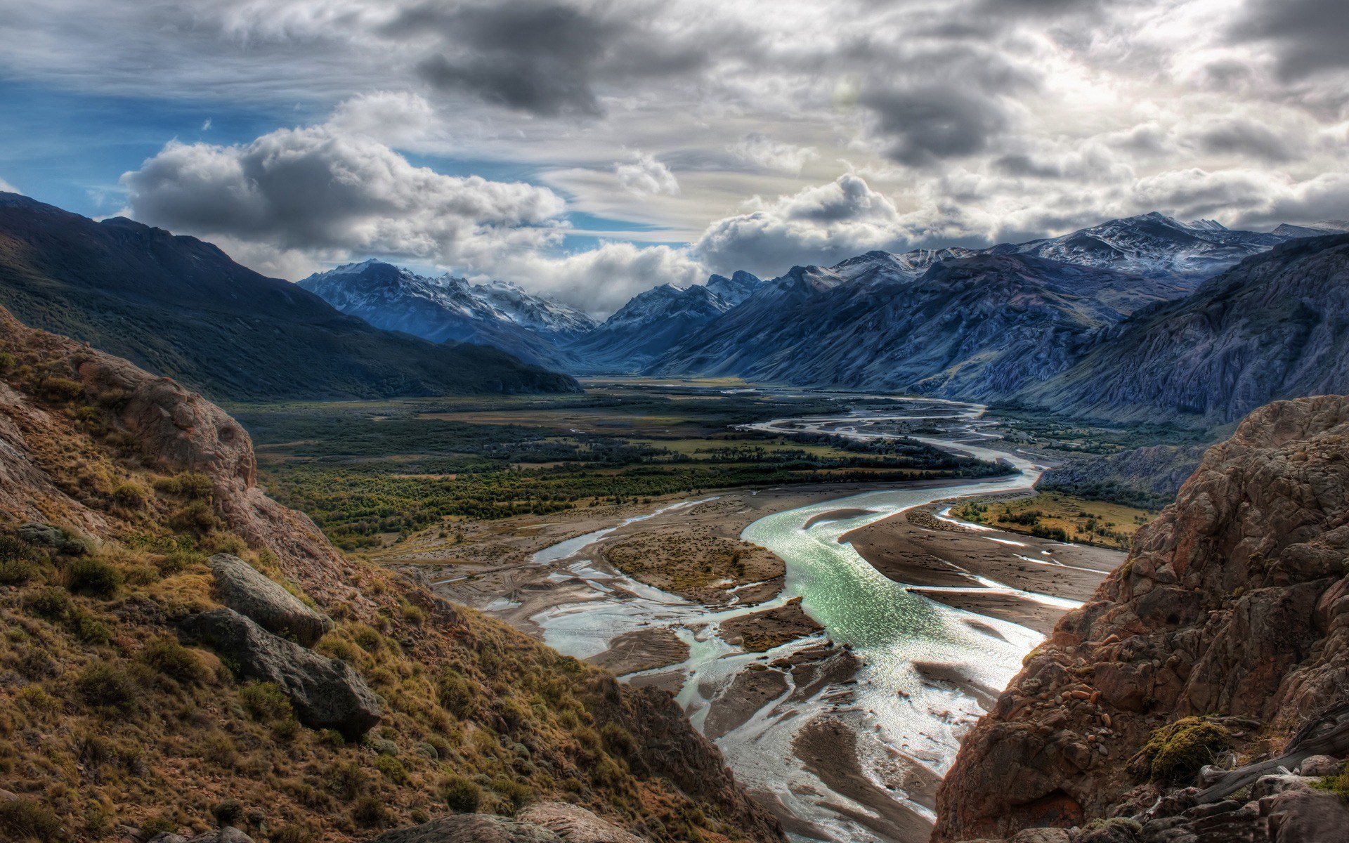 Winding River Valley Between Mountains Under Cloudy Sky HD Wallpaper