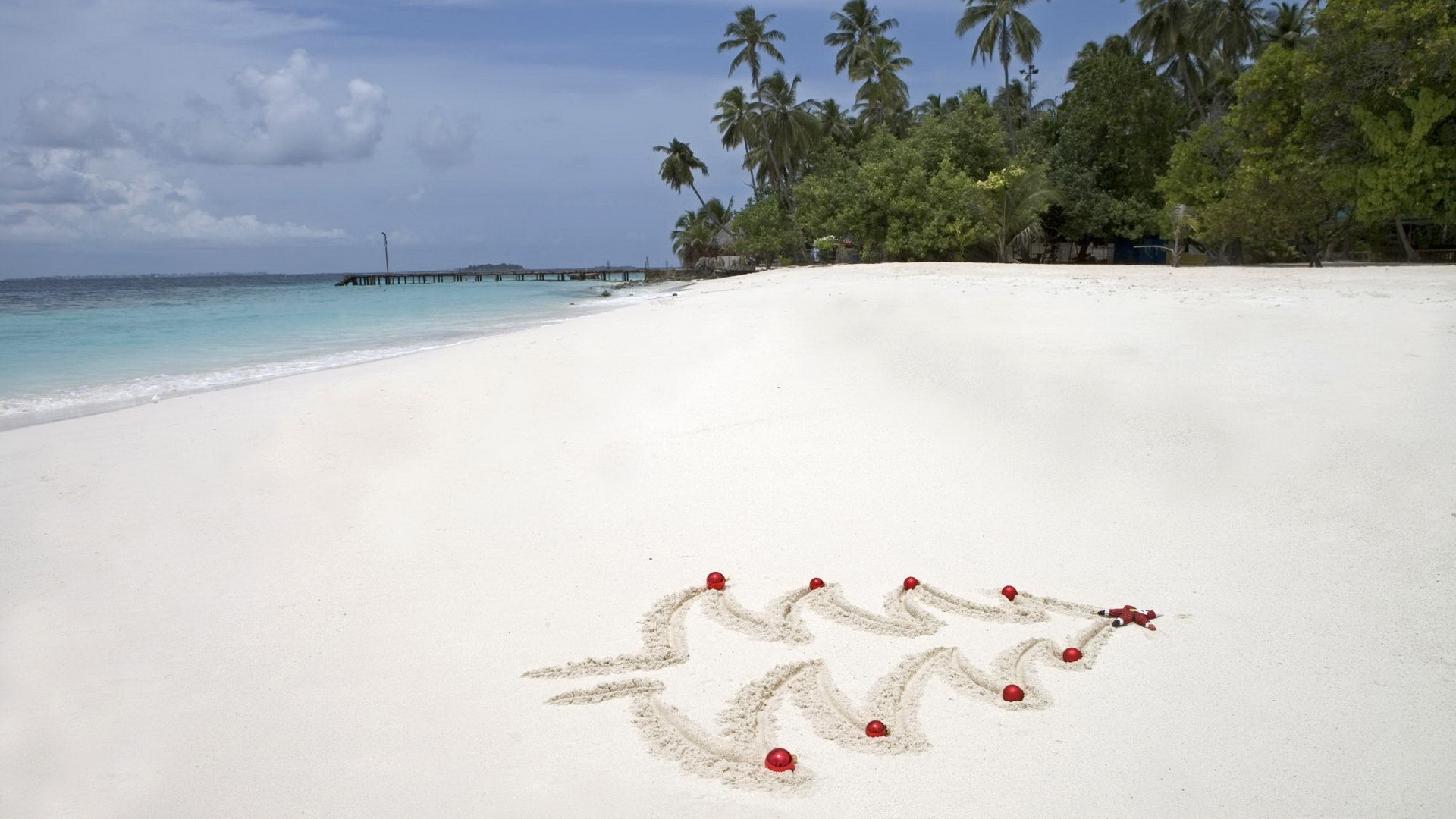 Christmas Tree Drawn in Sand with Ornaments on Tropical Beach HD Wallpaper