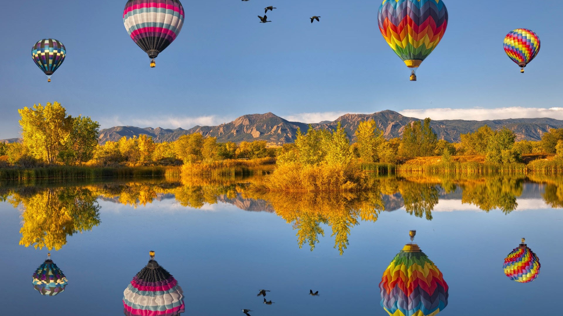 Hot Air Balloons Reflected in a Lake with Mountains HD Wallpaper