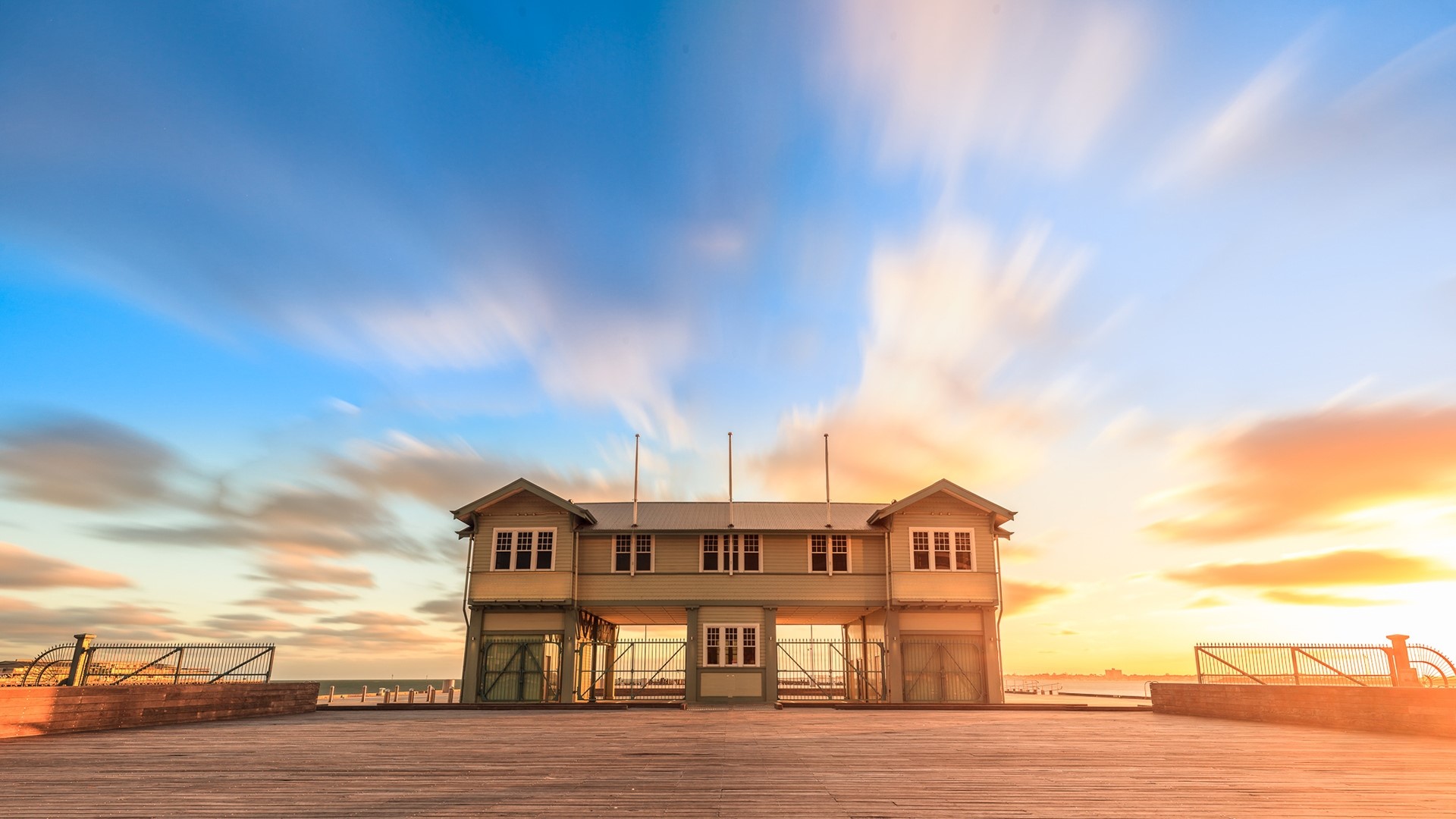 Beach house on a pier at sunset HD Wallpaper
