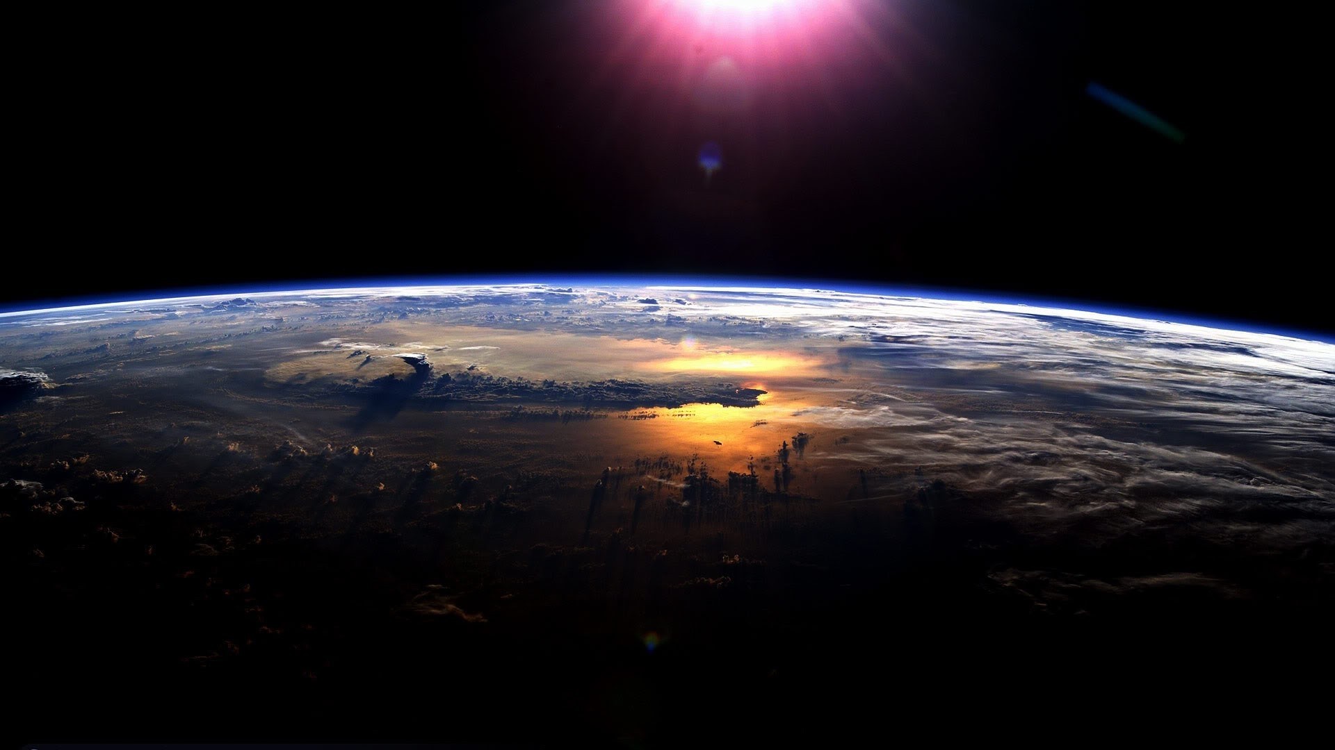 Earth from space with sun glare HD Wallpaper
