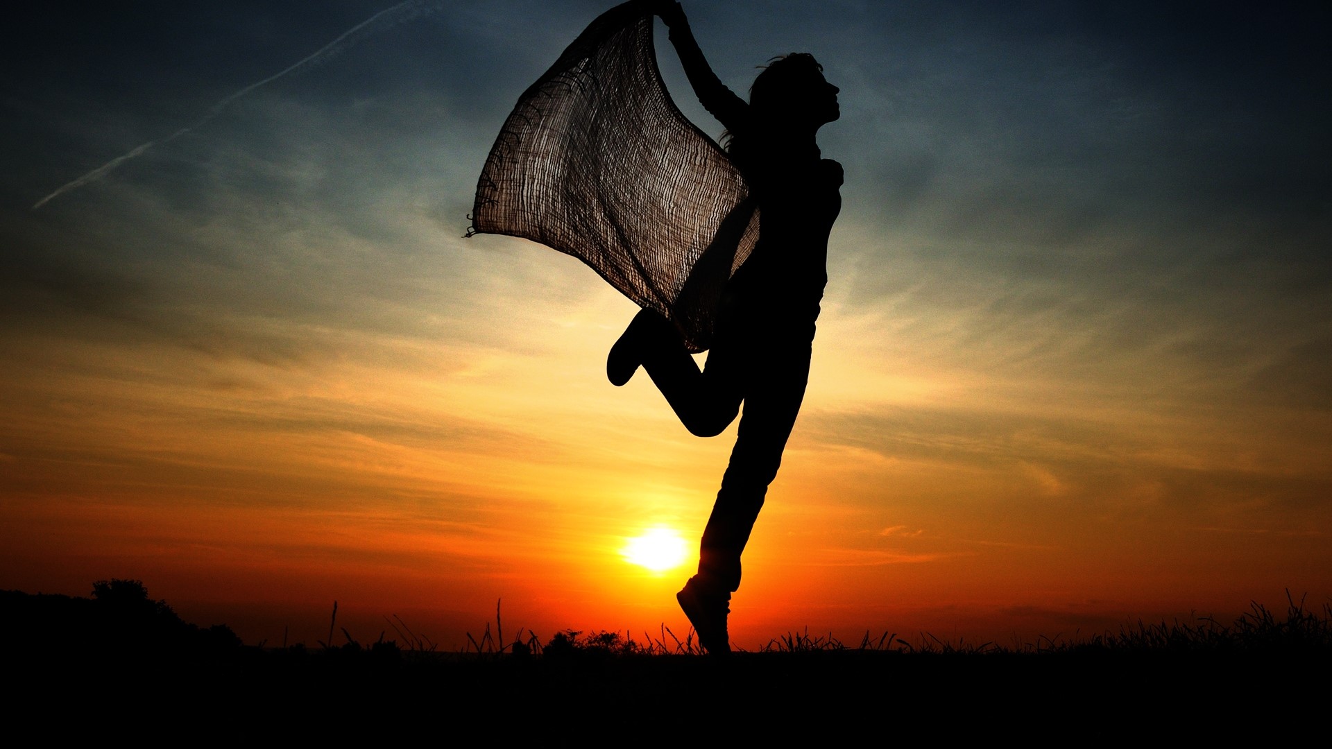 Silhouette of a woman dancing at sunset HD Wallpaper