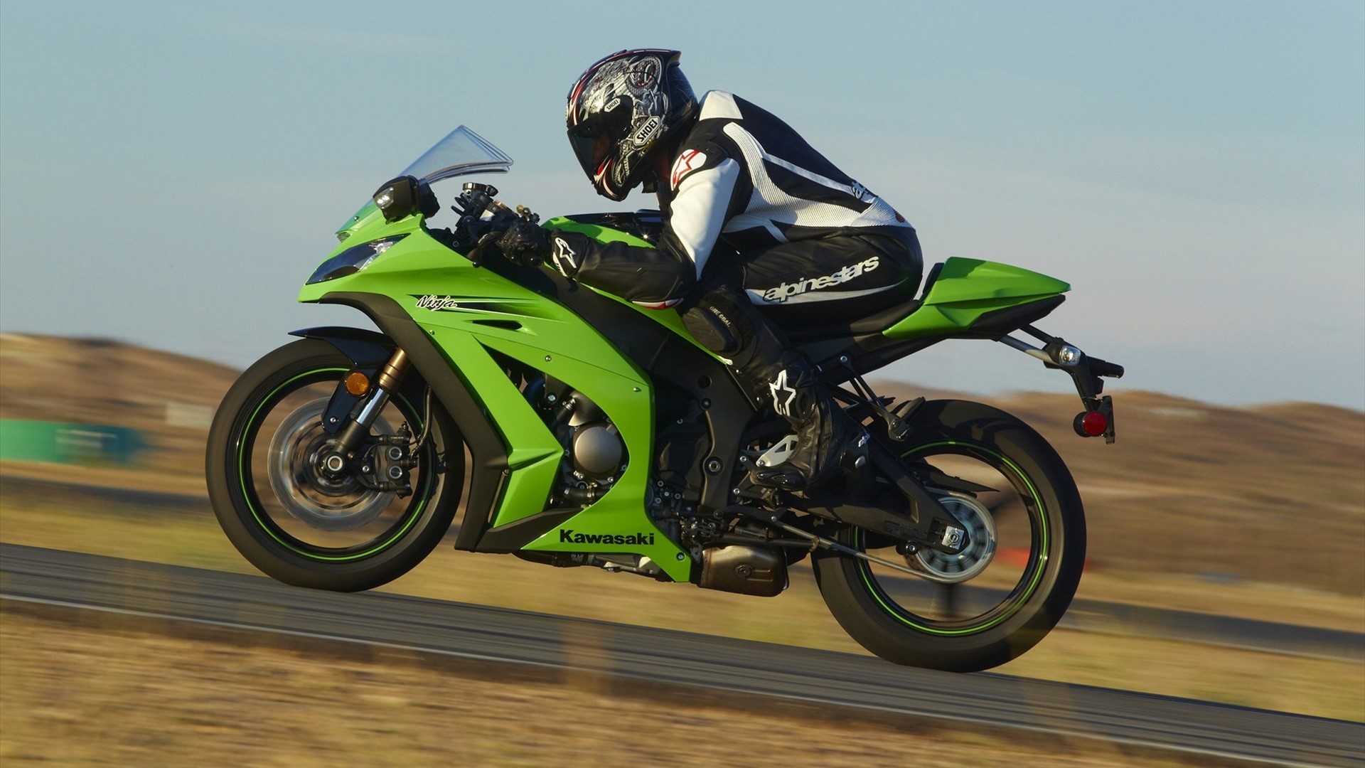 Green Kawasaki Ninja Motorcycle on Race Track HD Wallpaper