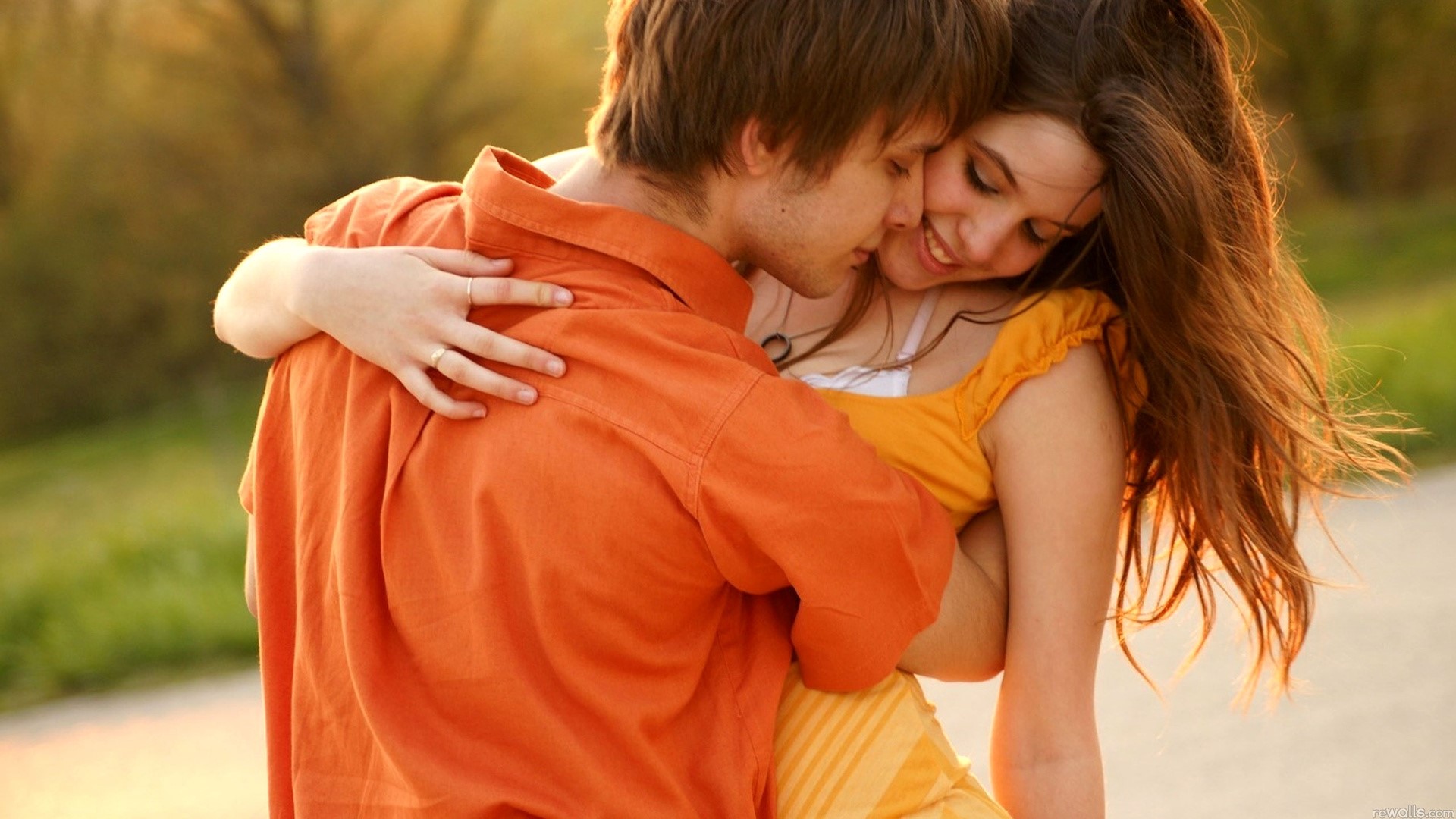 Romantic couple embracing outdoors HD Wallpaper