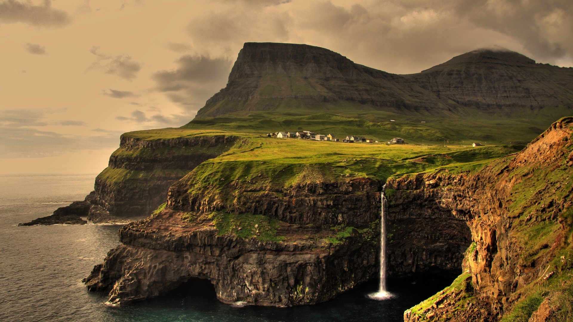 Faroe Islands village with waterfall and cliffs HD Wallpaper