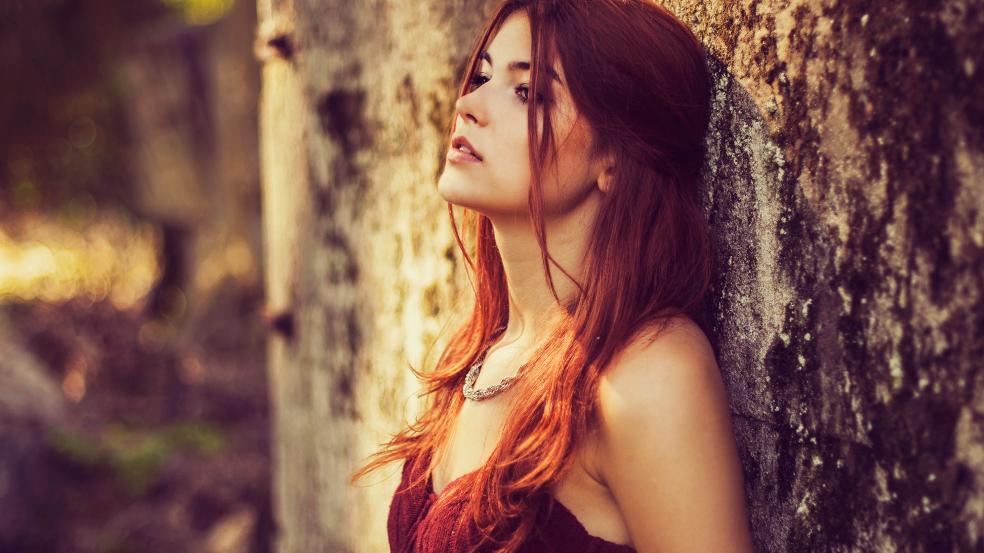 Redhead girl leaning against a wall HD Wallpaper
