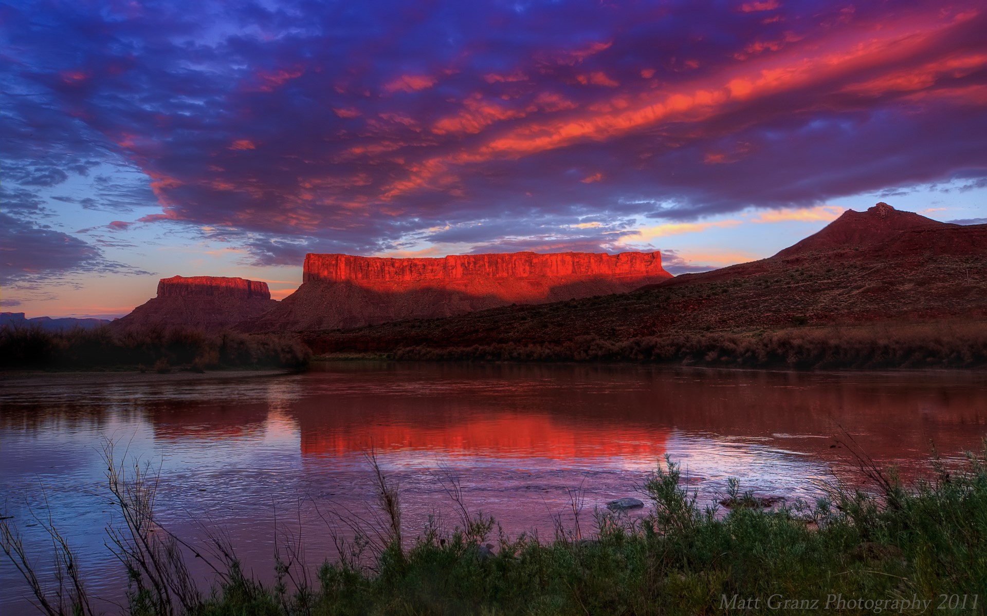 Sunset over a river with mesas and dramatic clouds HD Wallpaper